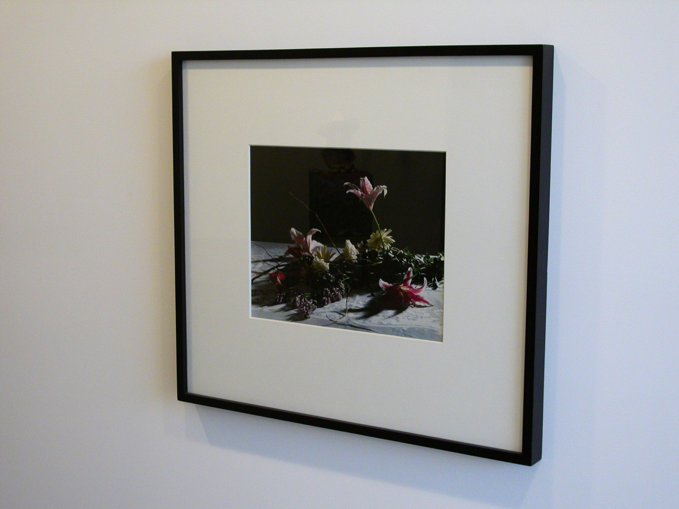 Christopher Williams, Bouquet, for Bas Jan Ader and Christopher D’Arcangelo, 1991 (detail), Archival corrugated board, archival photocorners, compound, 4-ply conservamat, 8-ply conservamat, drywall, dye transfer print, glass, lacquer-based finish, linen tape, nails, Northern maple, plastic set back strips, primer, screws, seaming tape, paint and wood, Print: 16 x 20 inches, Wall: 120 x 180 x 6 ¾ inches
