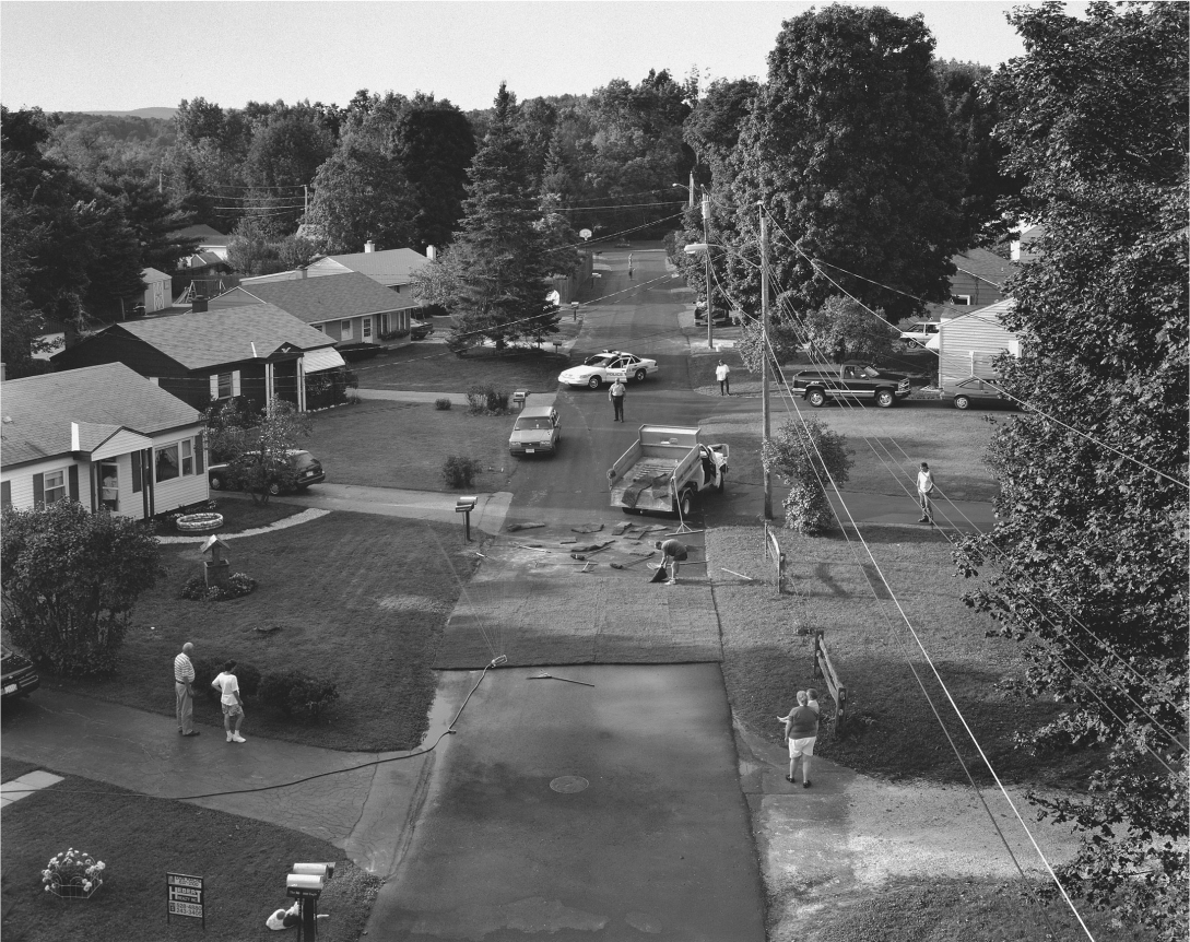 Gregory Crewdson, Untitled (man sodding street closed), 1996