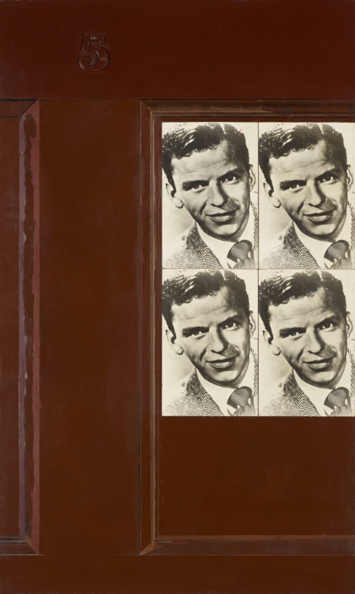 Red brown door with two pasted pictures of Frank Sinatra