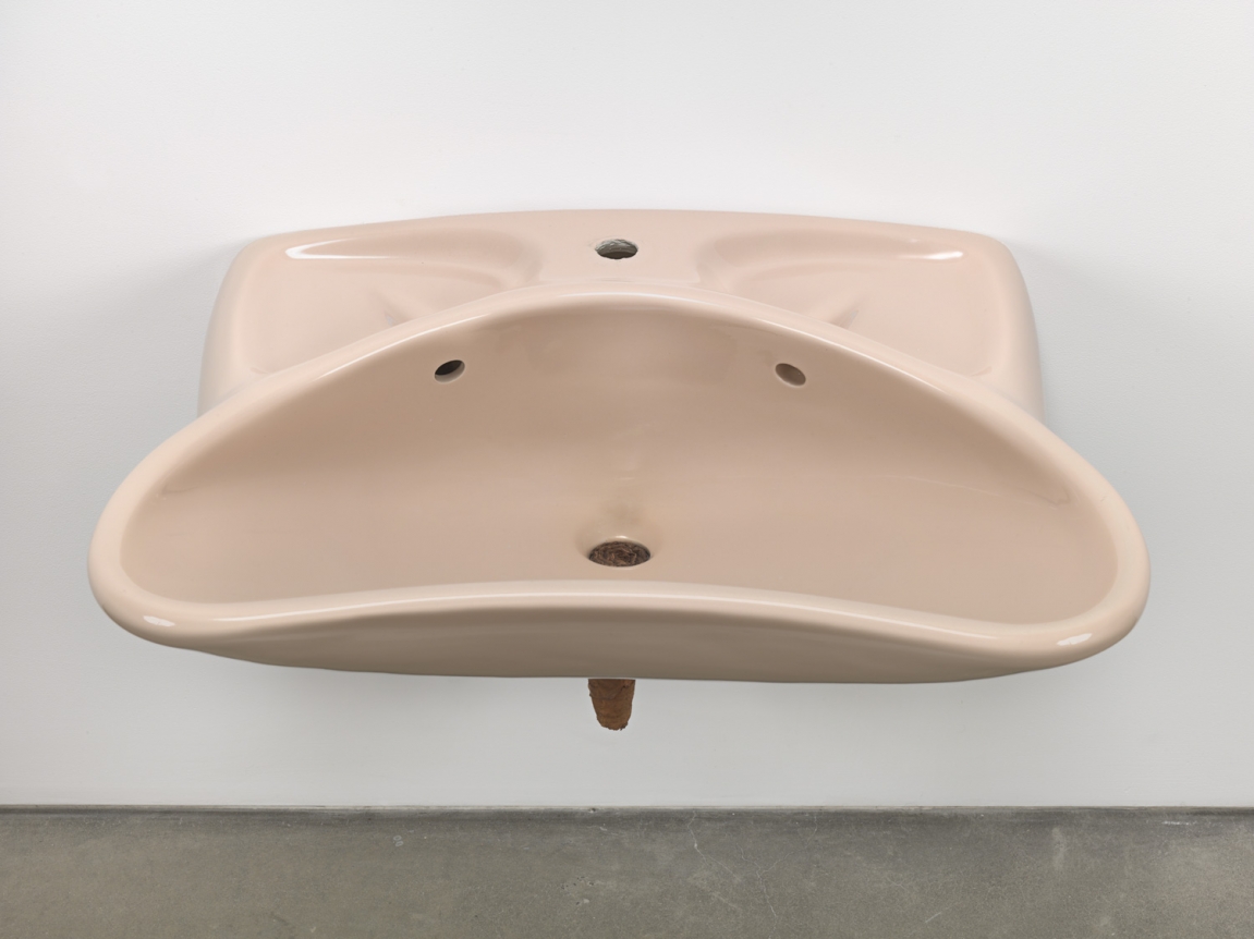 Plug, 2018. Ceramic sink, hand-rolled cigar,