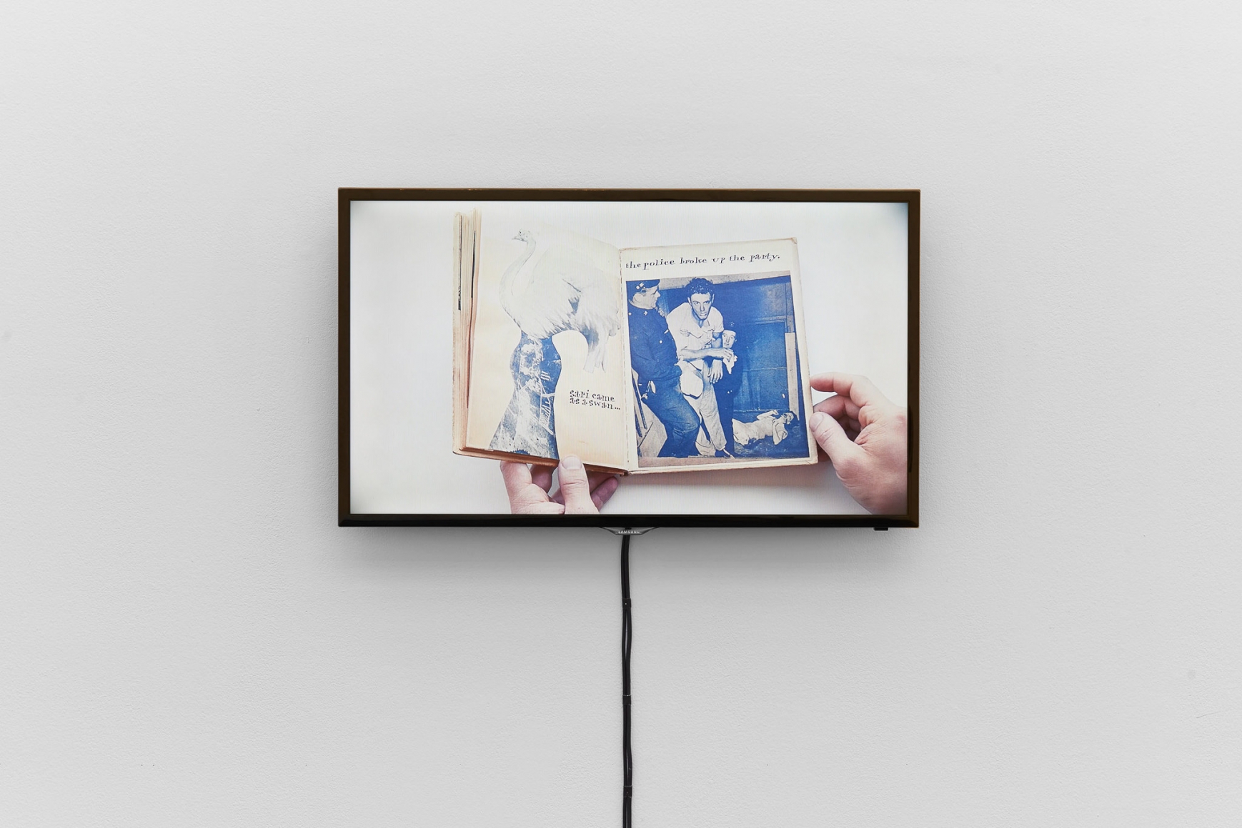 Installation view, Bizarre Silks, Private Imaginings and Narrative Facts, etc., an exhibition by Nick Mauss, view on video documentation of Ray Johnson’s artist book Ray Gives a Party, ca. 1955, Kunsthalle Basel, 2020. Photo: Philipp Hänger / Kunsthalle Basel