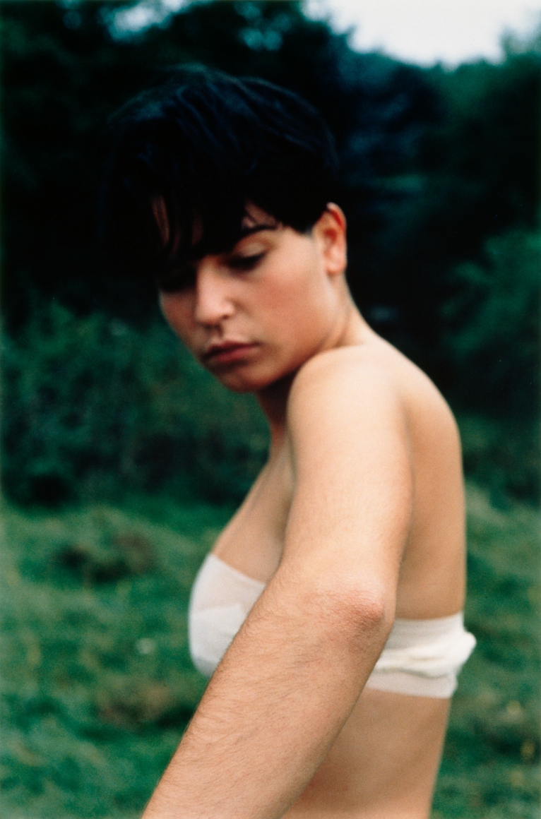 Collier Schorr, Contralto hidden behind the sinuous folds of a silk curtain, 1996