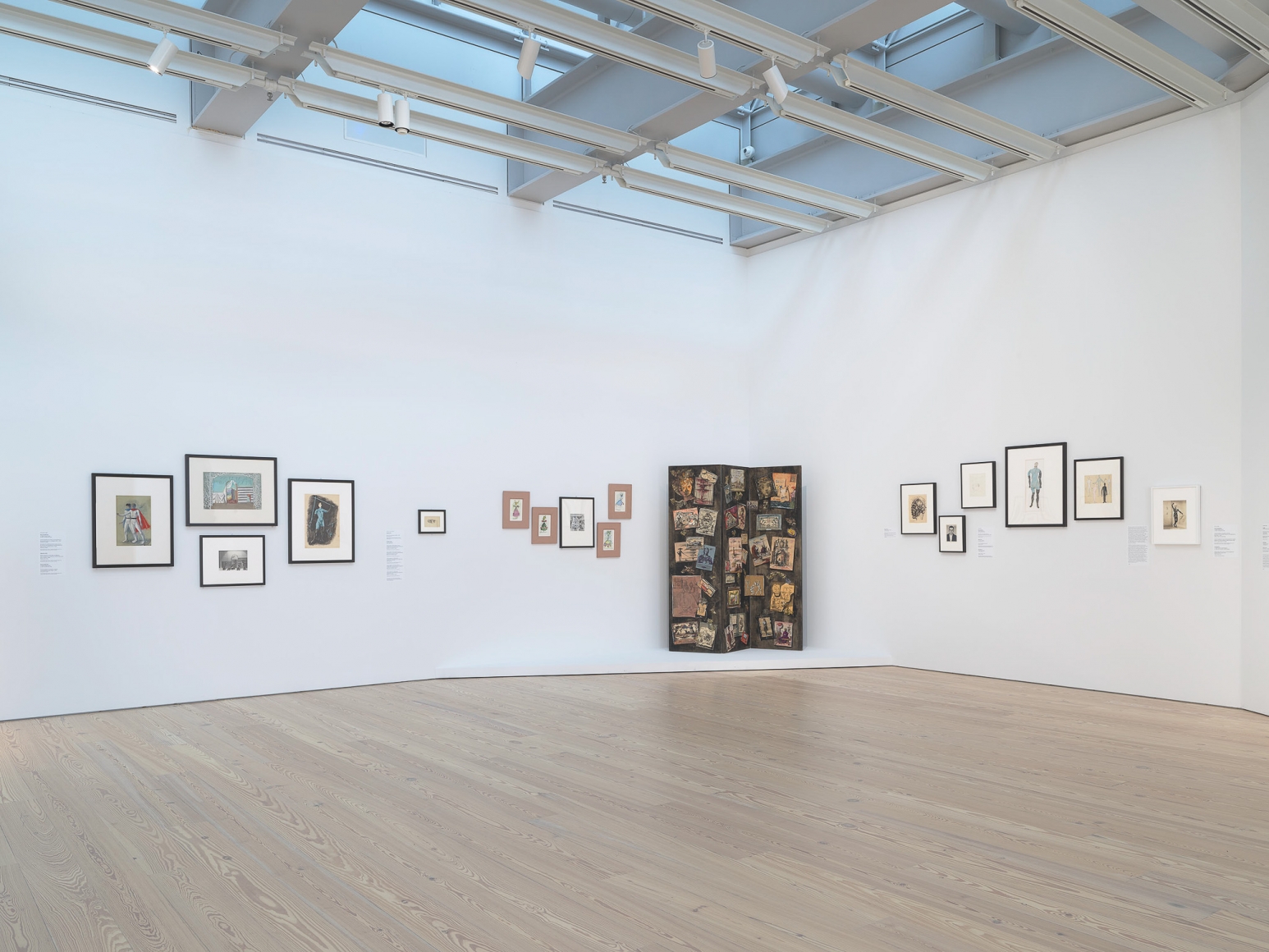 Installation view of Nick Mauss: Transmissions, Whitney Museum of American Art, New York, 3/16 - 5/14/2018, Left to right, top to bottom: Pavel Tchelitchew, Costume designs for Variations on Euclid, (premiered as Expanding Universe), choreographed by Ruth Page for XX, c. 1946-48; Pavel Tchelitchew, Set design by Pavel Tchetlichew for Nobilissima Visione (also known as St. Francis), choreographed by Leonide Massine for Ballets Russe de Monte Carlo, c. 1938; Pavel Tchelitchew, Window display for shoes after set design by Pavel Tchelitchew for Nobilissima Visione (also known as St. Francis); Pavel Tchelitchew, Costume design for Variations on Euclid, choreographed by Ruth Page for XX, c. 1932; Unknown artist, Dance of the Eyes (Dancer Loïe Fuller), c. 1907; Dorthea Tanning, Costume Design for dancer Merriam Lanova in The Night Shadow, choreographed by George Balanchine for Ballet Russe de Monte Carlo, 1945; Dorthea Tanning, Costume design for dancer Shirley Weaver in The Night Shadow, choreographed by George Balanchine for Ballet Russe de Monte Carlo, 1945; Dorthea Tanning, Costume designs by Dorthea Tanning for The Night Shadow, choreographed by George Balchine for Ballet Russe de Monte Carlo, c. 1946-48; Dorthea Tanning, Costume design for dancer Shirley Weaver in The Night Shadow, choreographed by George Balanchine for Ballet Russe de Monte Carlo, 1945; Dorthea Tanning, Costume design for The Night Shadow, choreographed by George Balachine for Ballet Russe de Monte Carlo, 1945; Eugène Berman, Painted three-fold screen with watercolor sketches (1937-42), 1944; Pavel Tchelitchew, Head of Man (Interior Landscape), 1944; Walker Evans, Lincoln Kirstein (Without Hat), 1931; Elie Nadelman, Head of a Woman, c. 1925; Pavel Tchelitchew, Costume Design for Variations on Euclid (premiered as Expanding Universe), choregraphed by Ruth Page for XX, c. 1932; Pavel Tchelitchew, Costume designs for Ode, choreographed by Leonide Massine for Sergei Diaghilev’s Ballets Russes. Photograph by Ron Amstutz. Digital image © Whitney Museum of American Art, New York