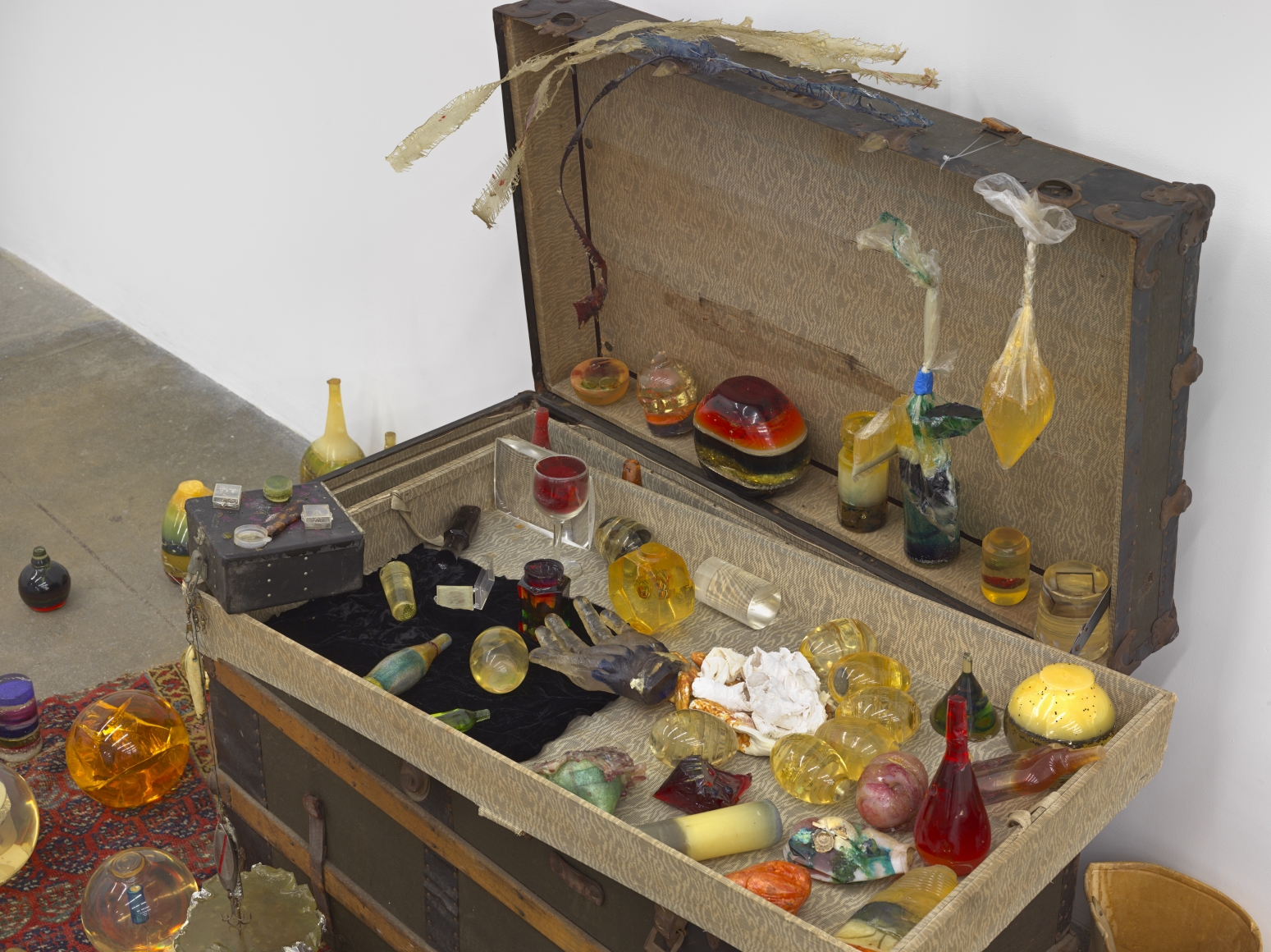 Barbara T. SmithTrunk Piece, 1969-72Antique trunk, Persian carpet, 100 unique objects Dimensions variable