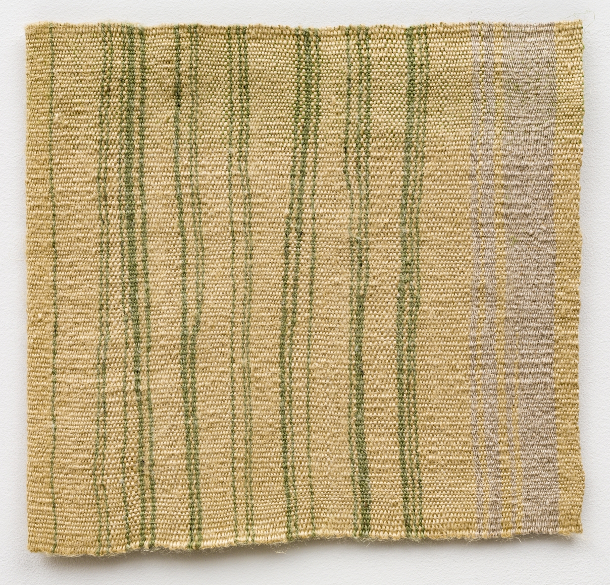 Helen Mirra Green tying bale edging