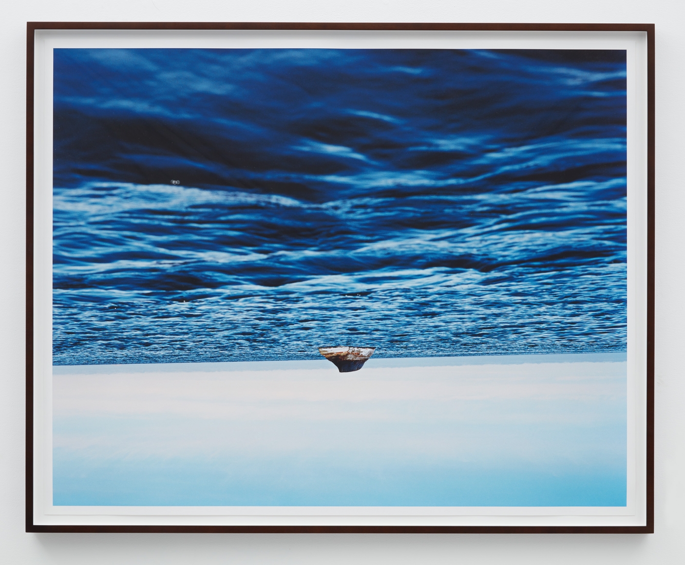a photograph of a boat on water by thiago rocha pitta who is interested in art about the environment