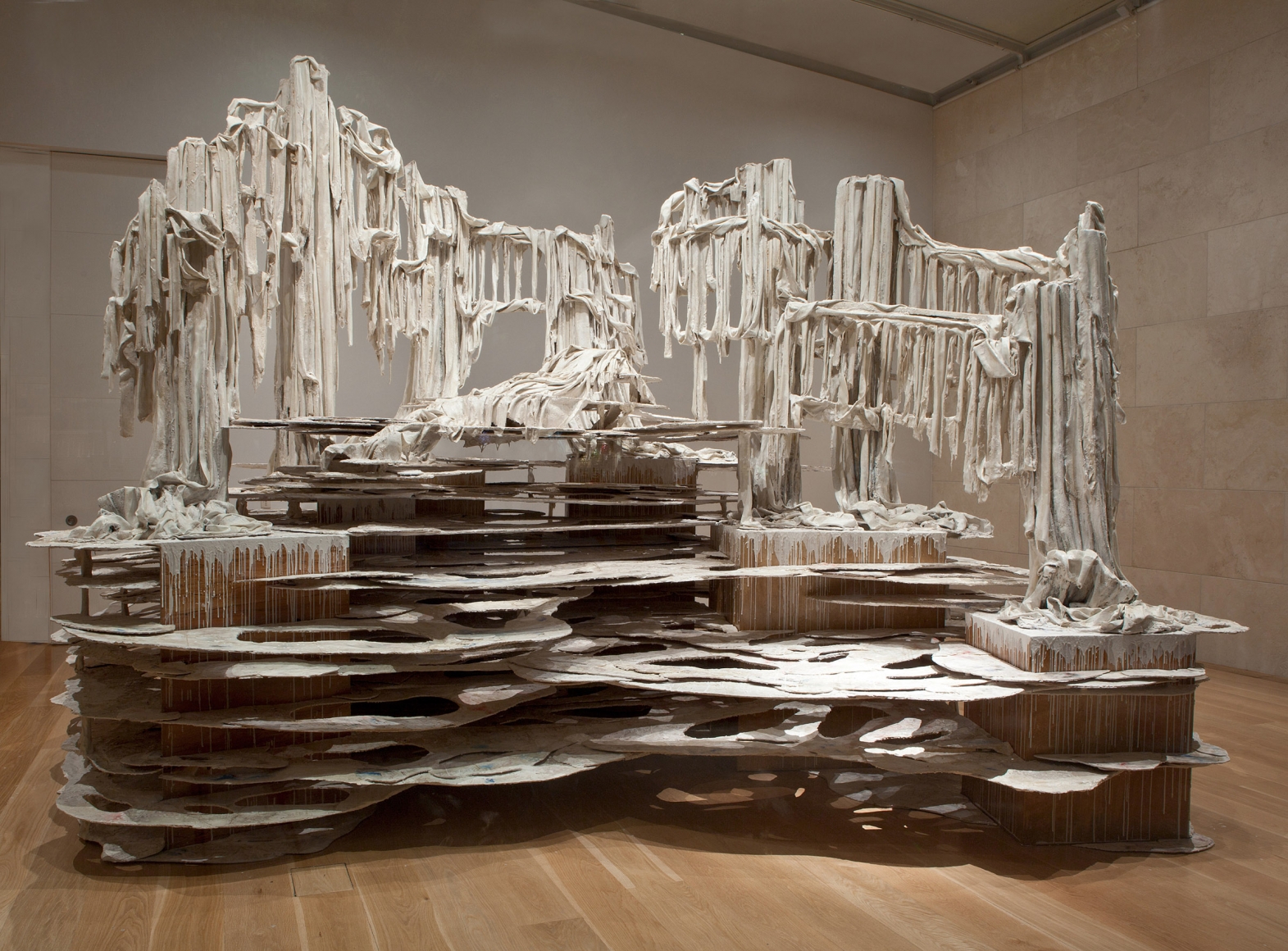 a large installation sculpture of dripping forms by Diana Al-Hadid