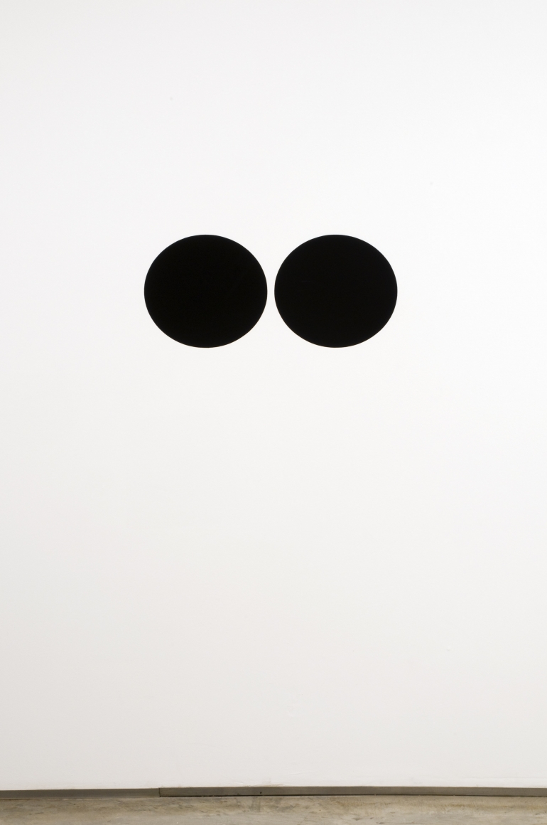 two black dots painted on wall by neil campbell