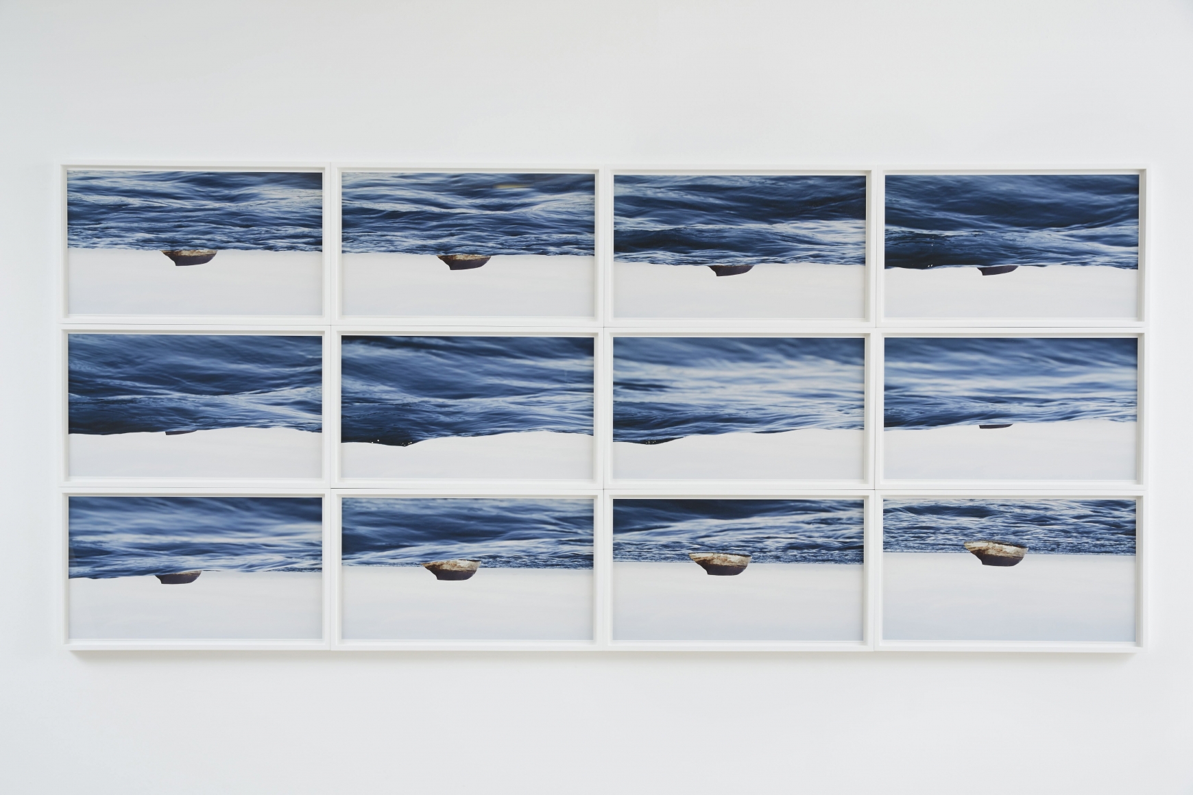 a series or a grid of photographs of a seascape by thiago rocha pitta