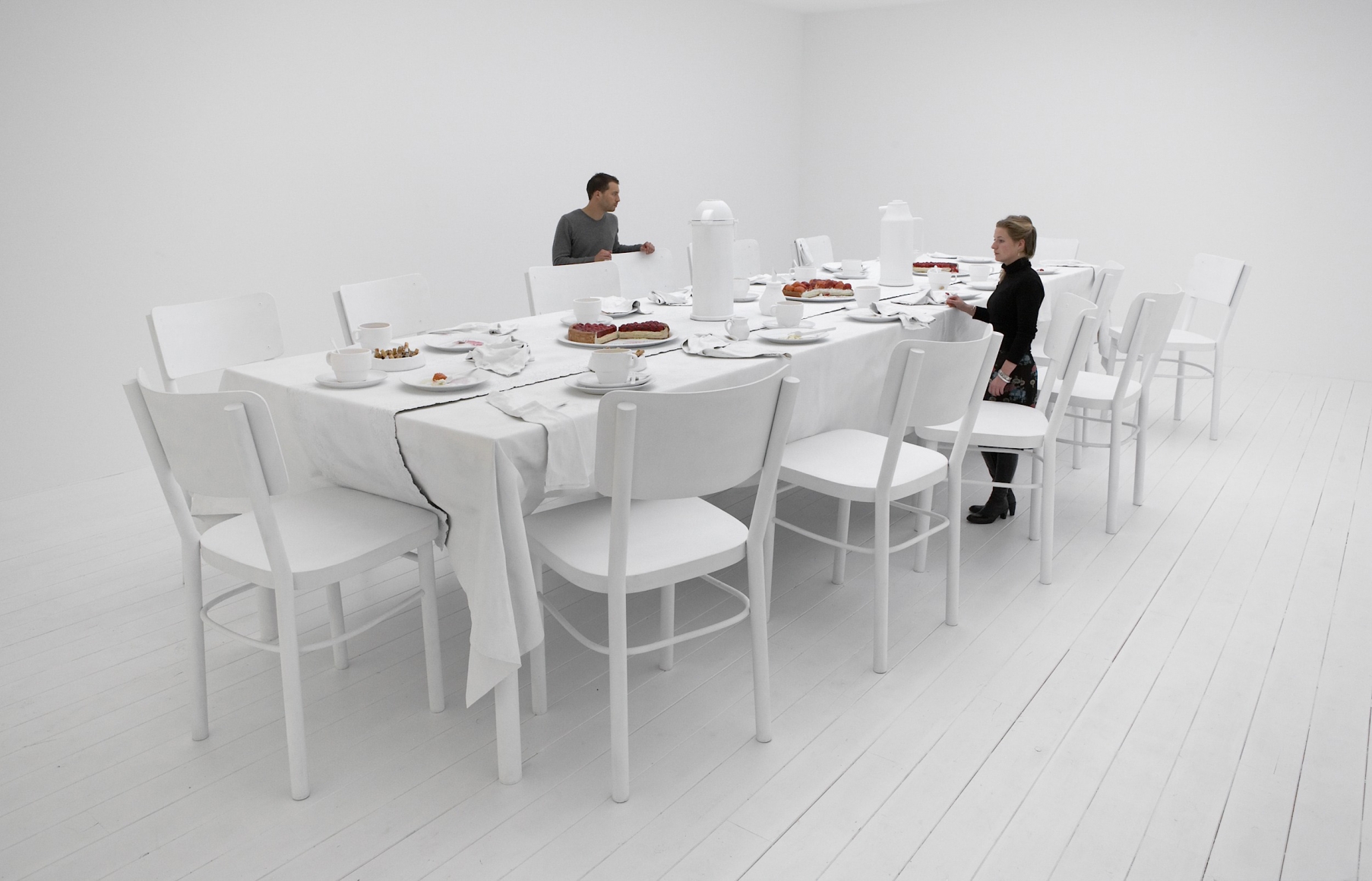 a dining table installation in an art gallery in Chelsea New York created by Hans Op de Beeck