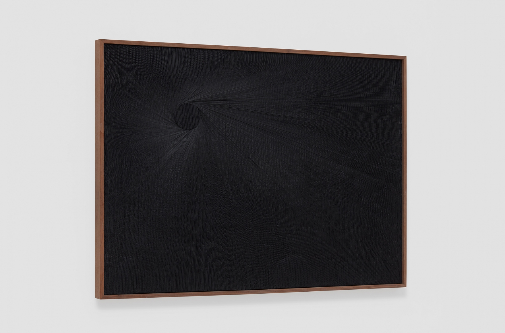 a dark black painting at an angle to see the cut plaster work by anthony pearson