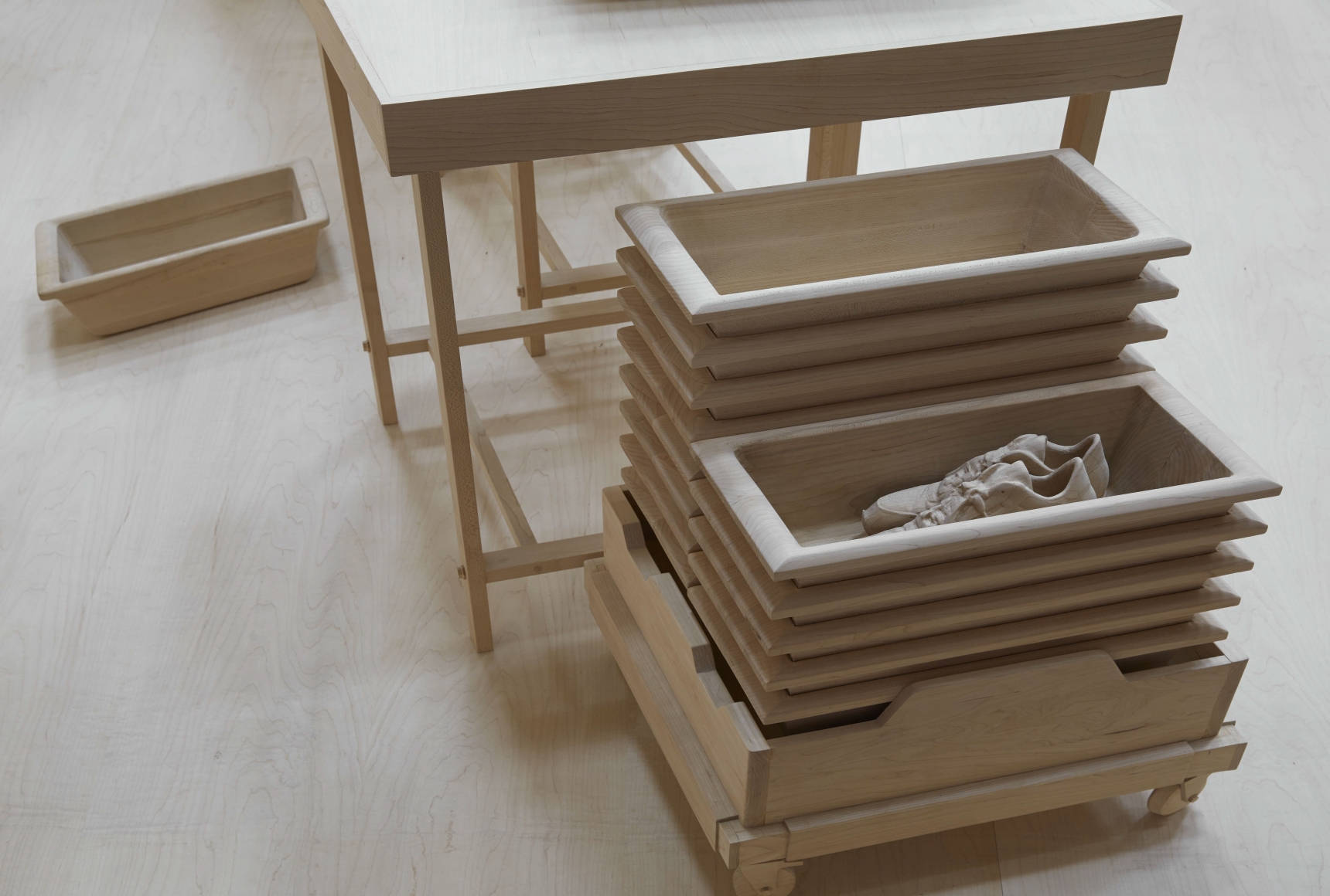 wood model of airport security bins by roxy paine