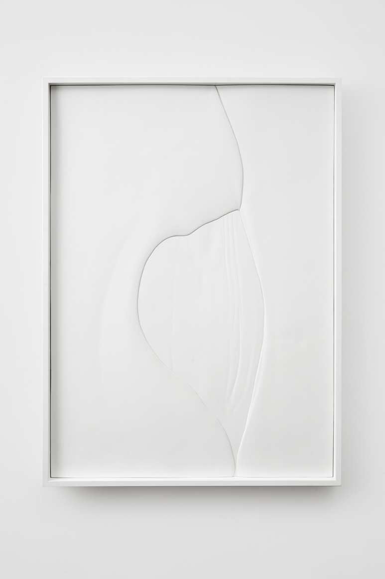 a white plaster artwork with flowing lines by anthony pearson