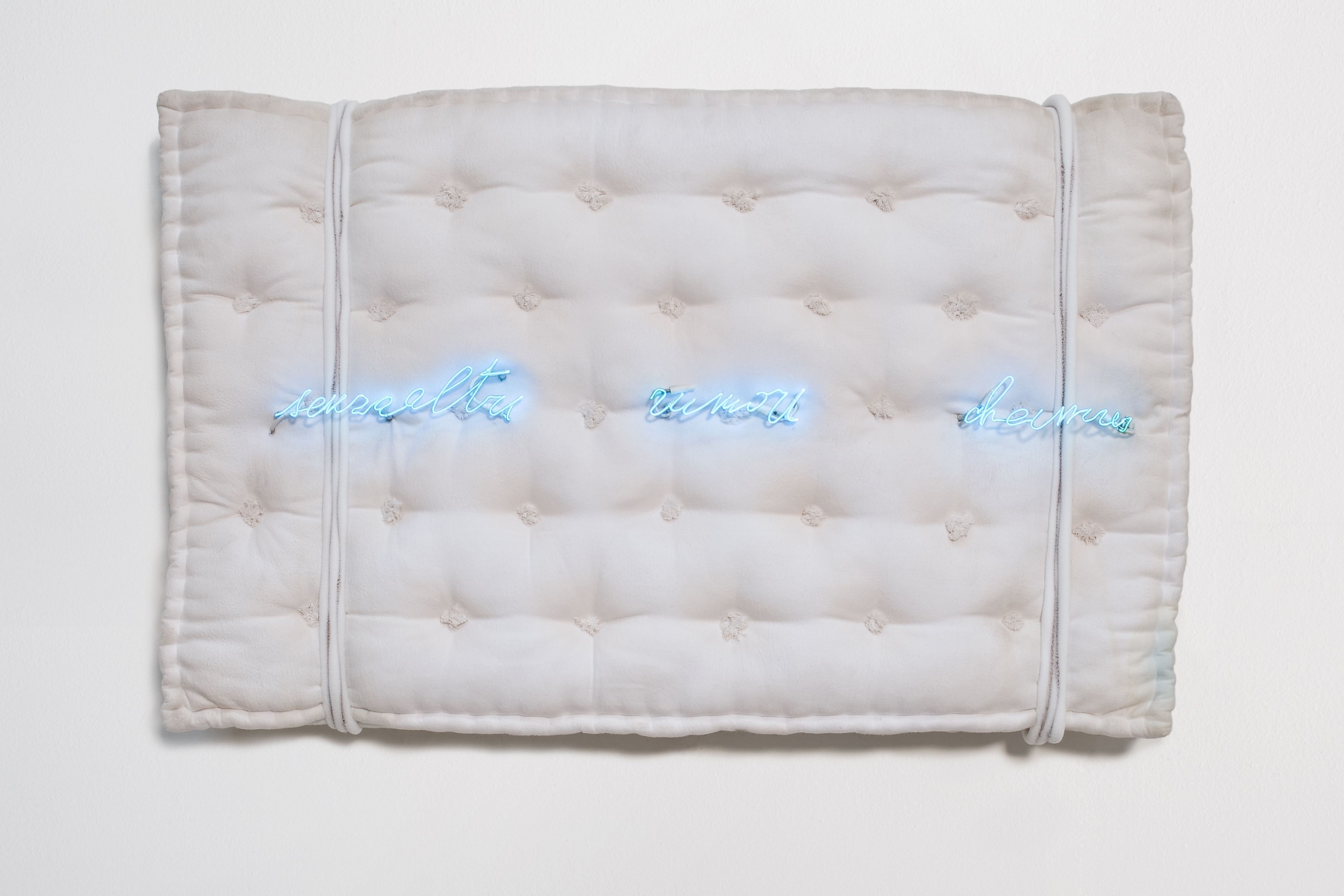 mattress with neon letters by pier paolo calzolari