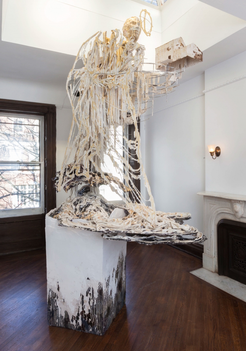 beige and white sculpture of an ascending figure by diana al-hadid
