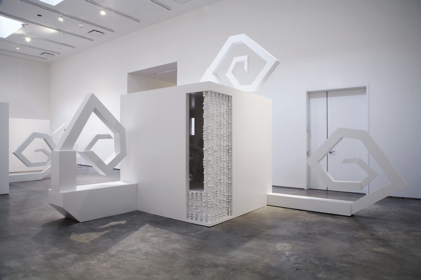 sculpture with twisting pieces by liz craft