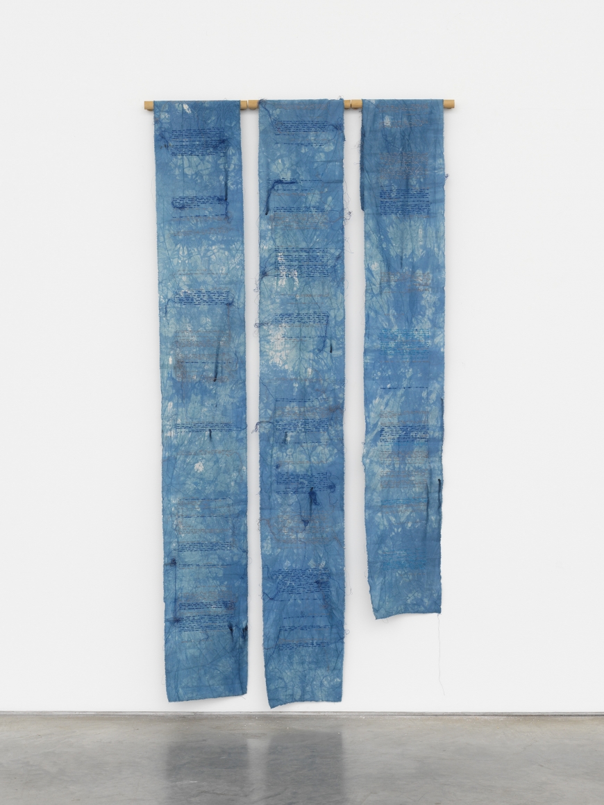 three hanging fabric panels in blue dye and embroidered by maria lai