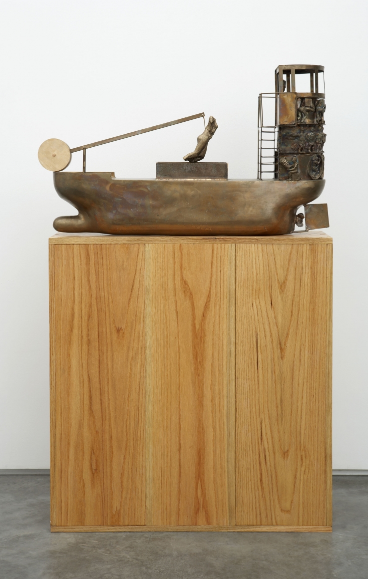 sculpture with boat on wooden pedestal by pentti monkkonen