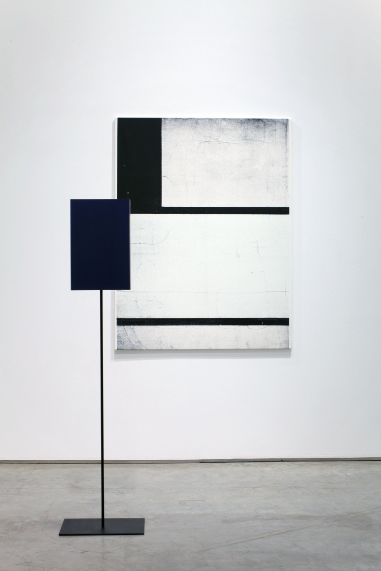 installation by melissa gordon with white and black grid painting and blue rectangular sculpture