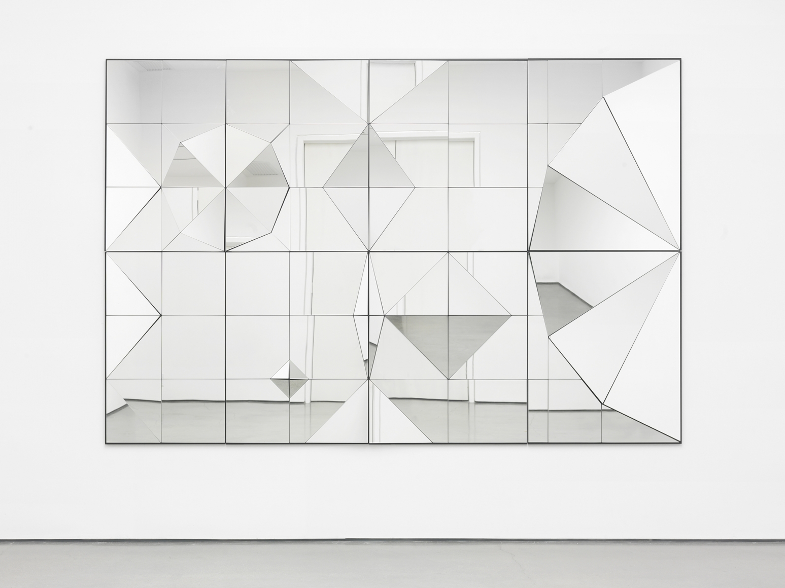a mirror artwork of geometric shapes by female artist claudia wieser