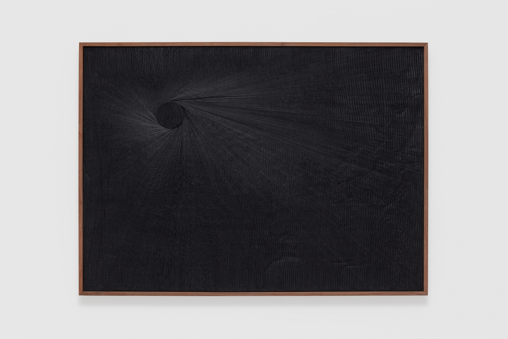 a dark black painting of cut plaster by anthony pearson