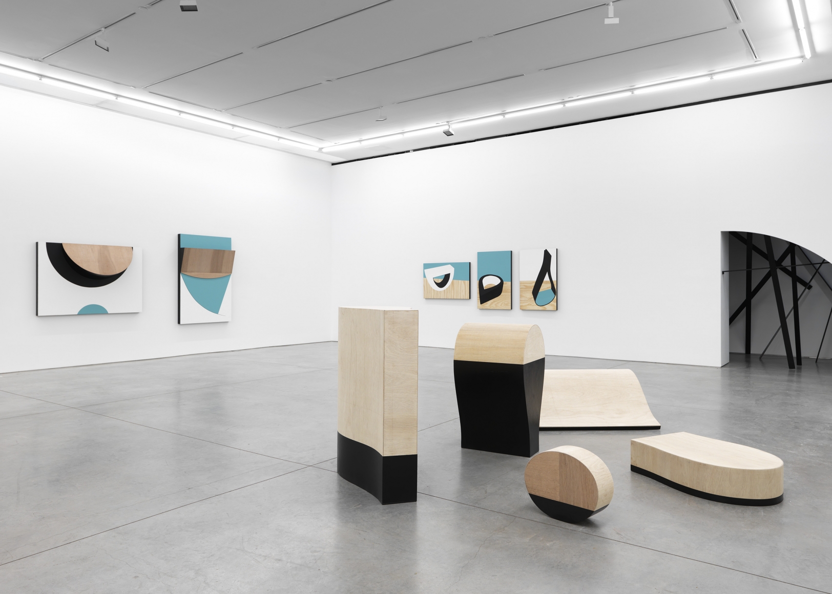 sculpture and artwork by serge alain nitegeka in a gallery