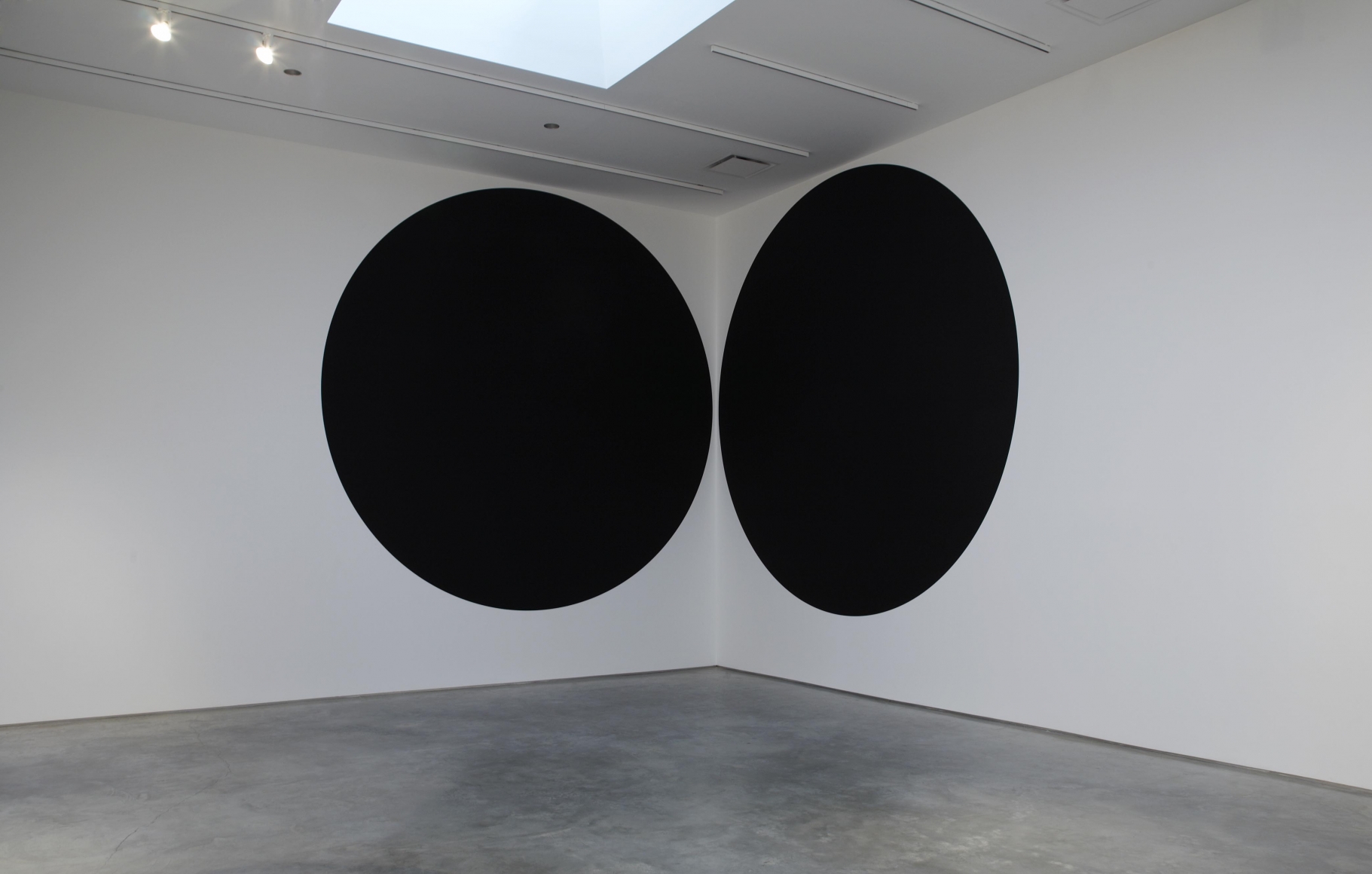 two black circles flanking corner by neil campbell