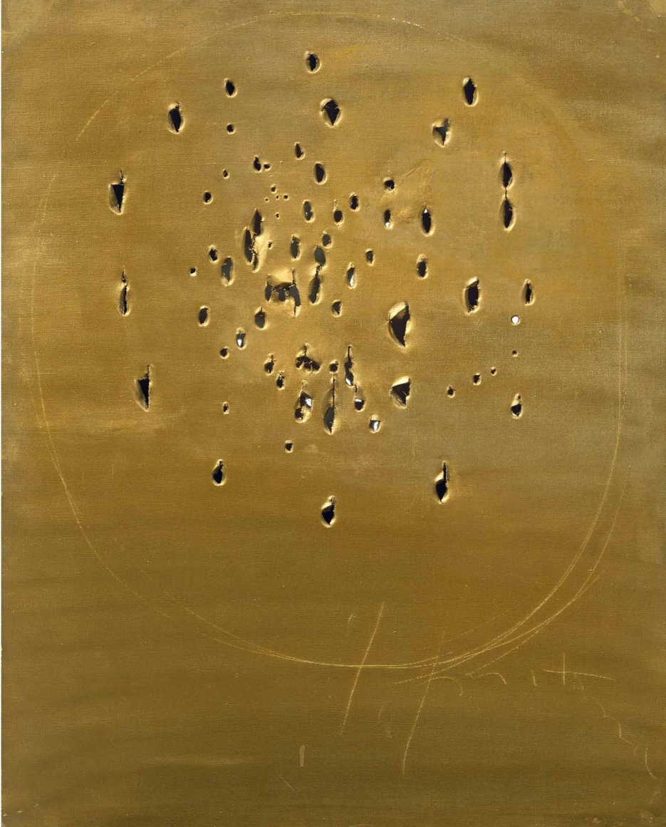 gold painting with holes by lucio fontana