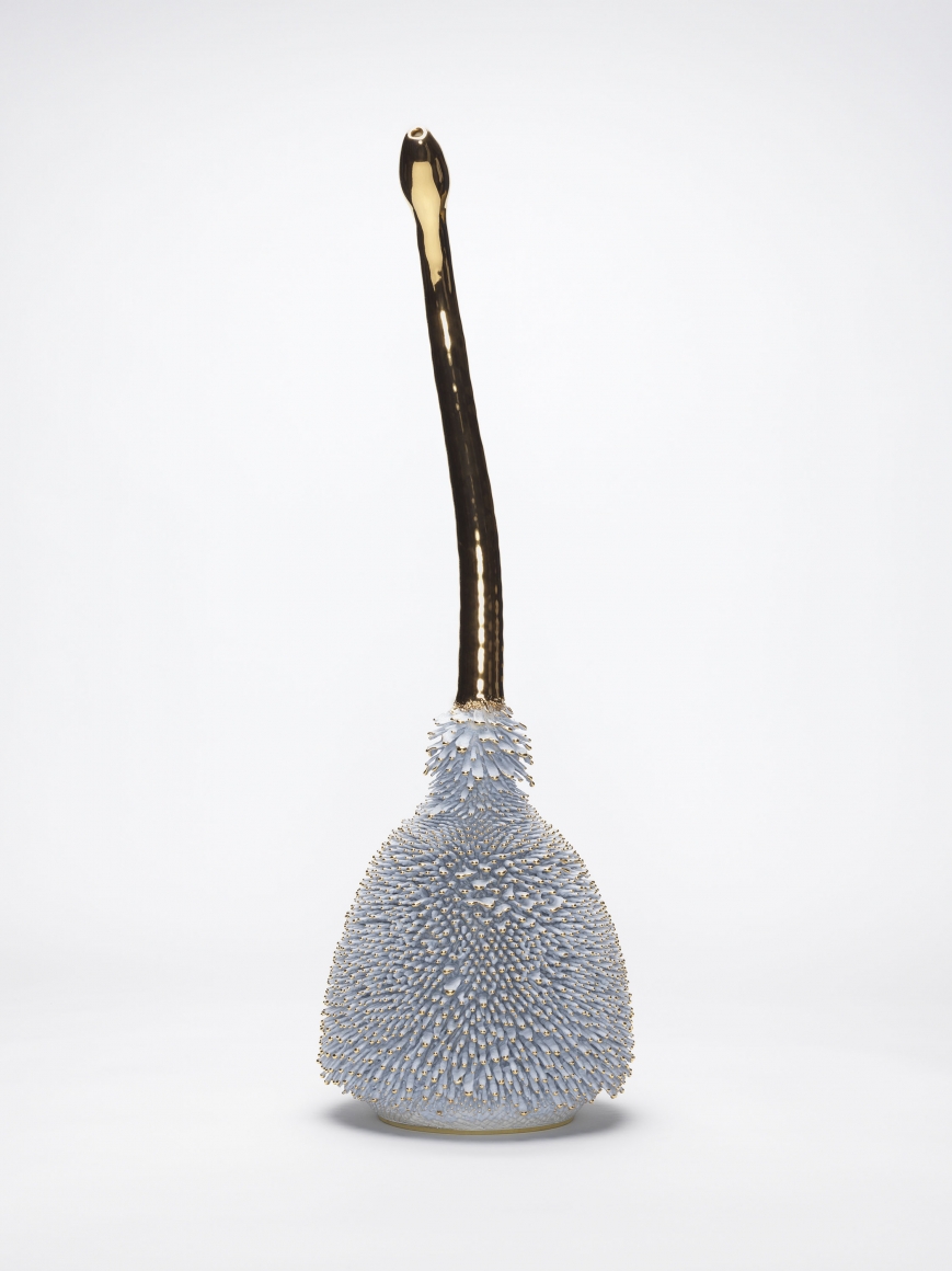 Gray porcelain sculpture with gold accents by the artists the haas brothers