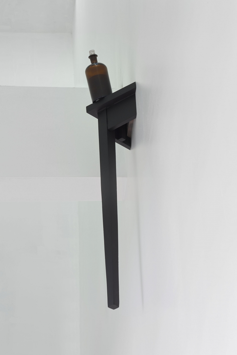 The sleep of birds in starwood, 2018, Wooden table leg, bottle, plaster, sugarcube