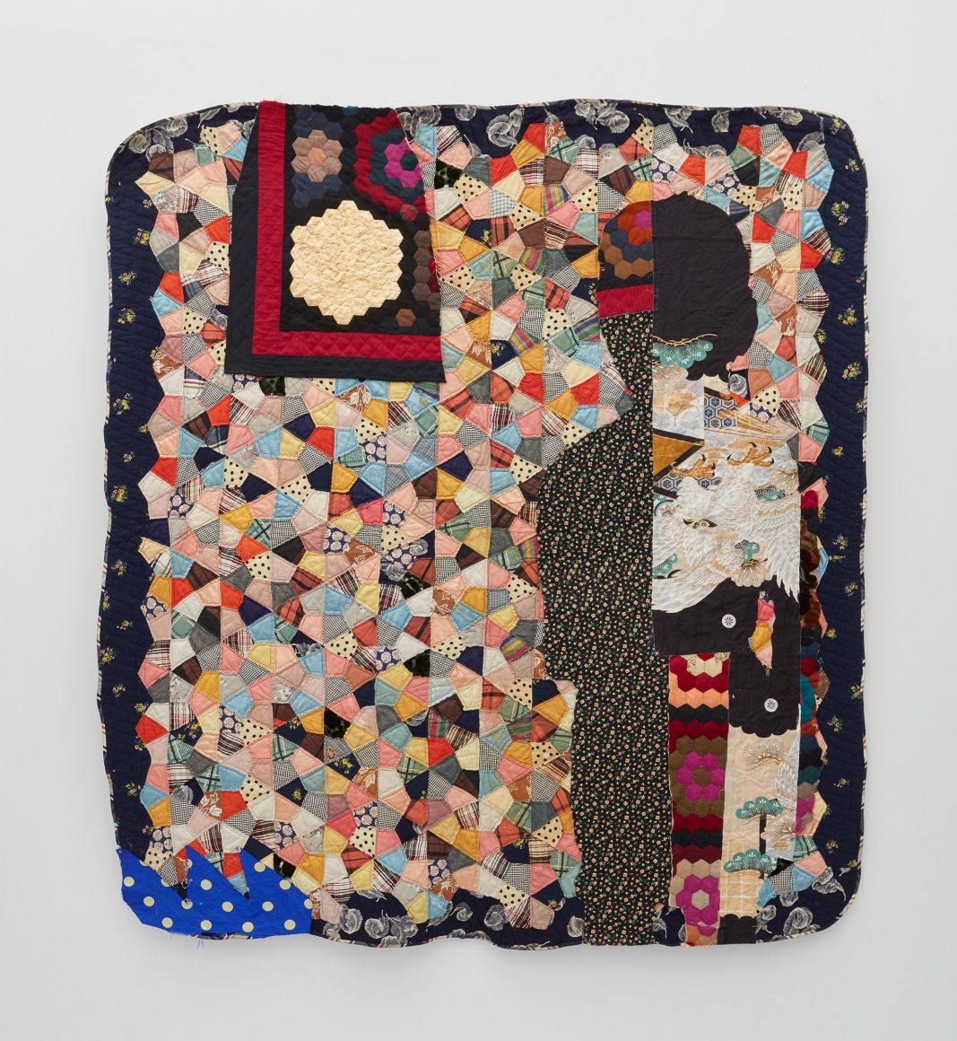 a contemporary quilt made out of antique quilt fragments by Sanford Biggers