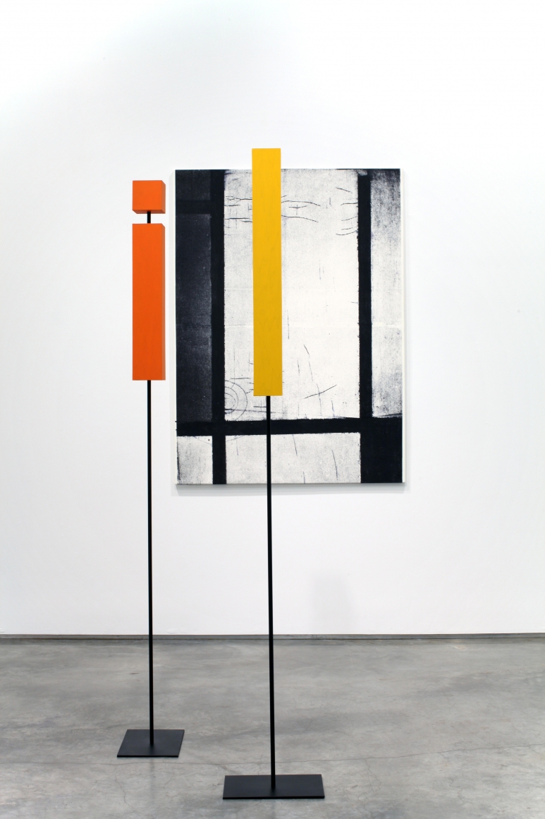 installation by melissa gordon with black and white grid painting and yellow and red rectangular sculptures