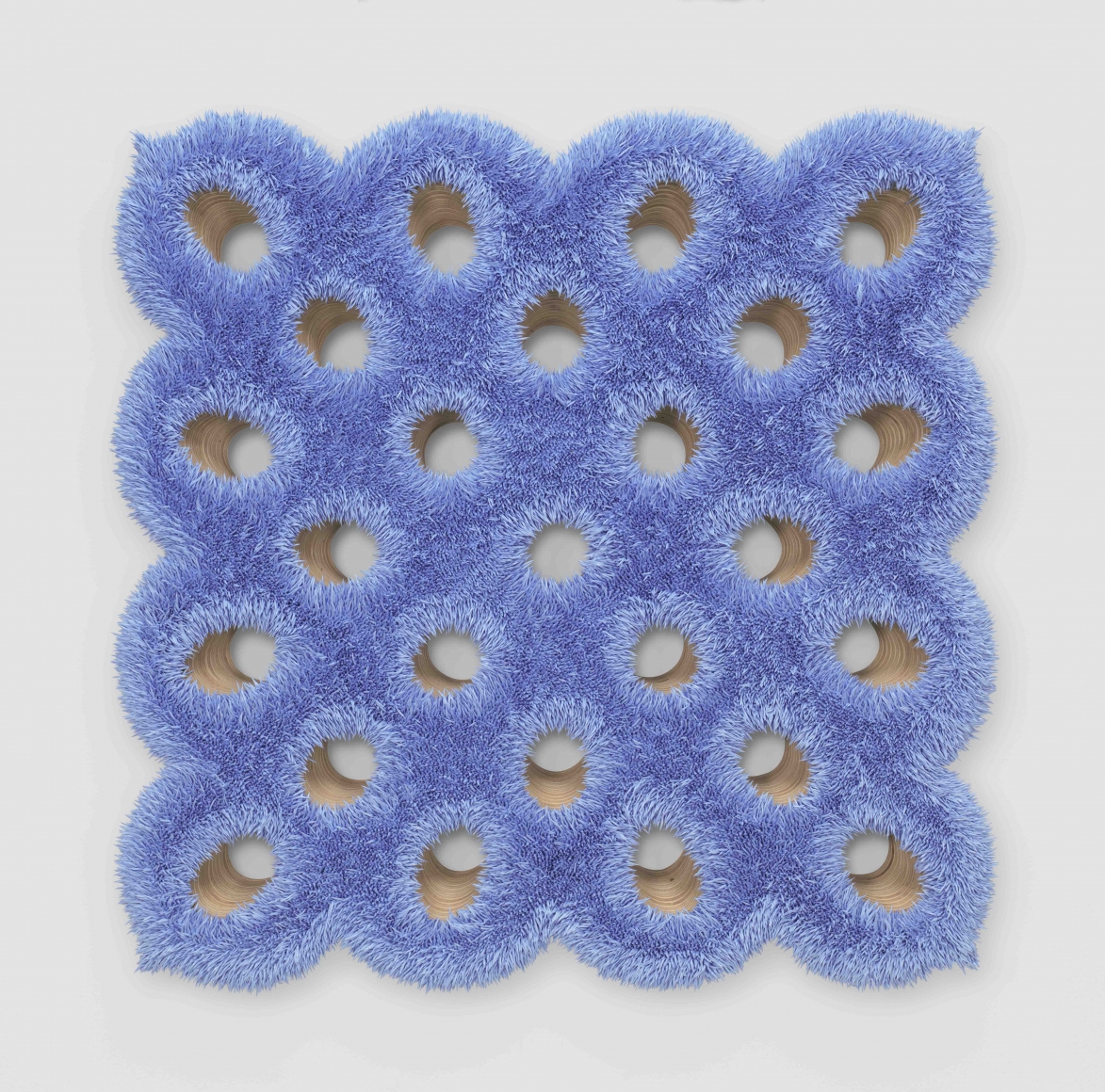 a spore painting by donald moffett with wood backing and small openings creating a geometric grid