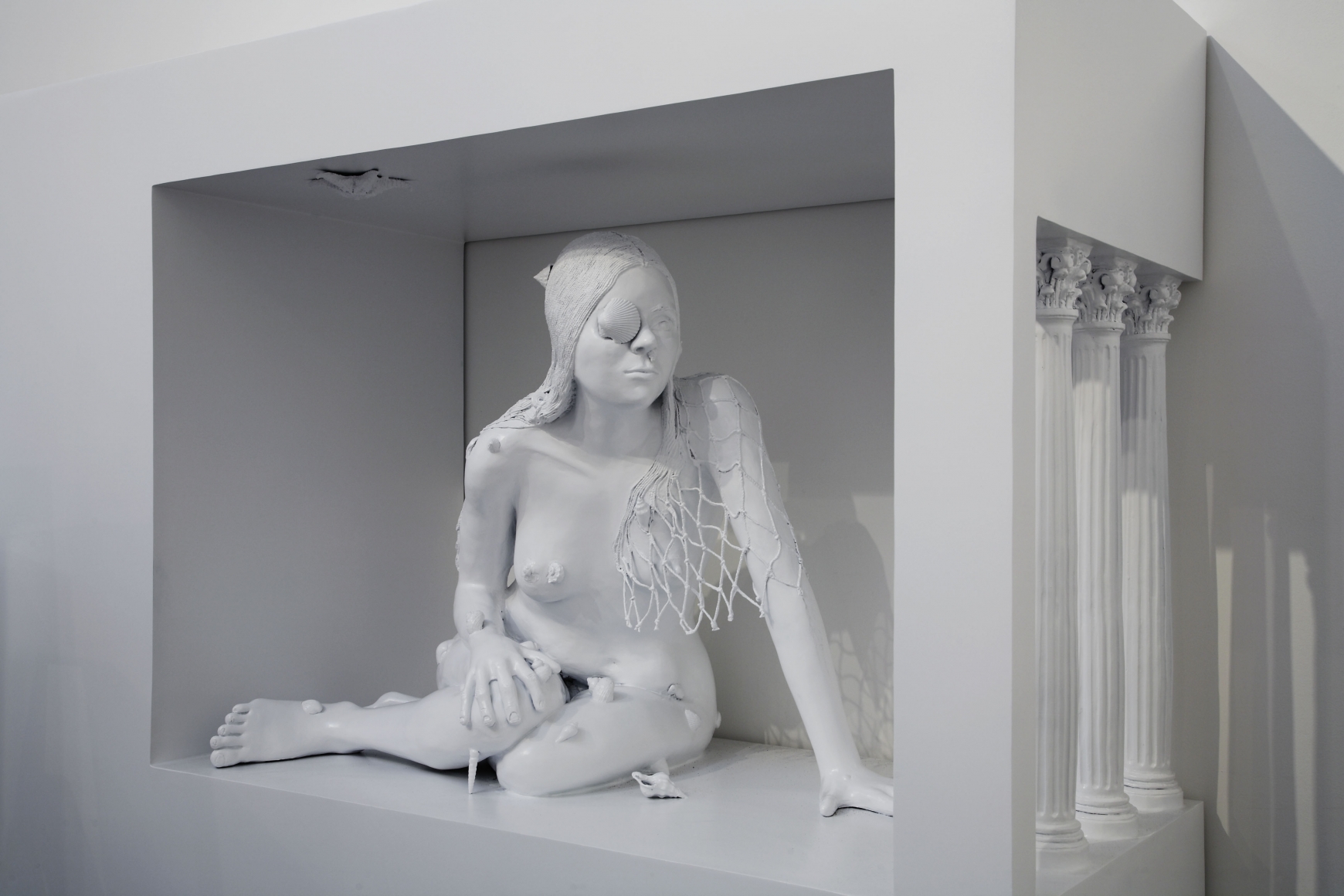 sculpture of a woman crouching by liz craft