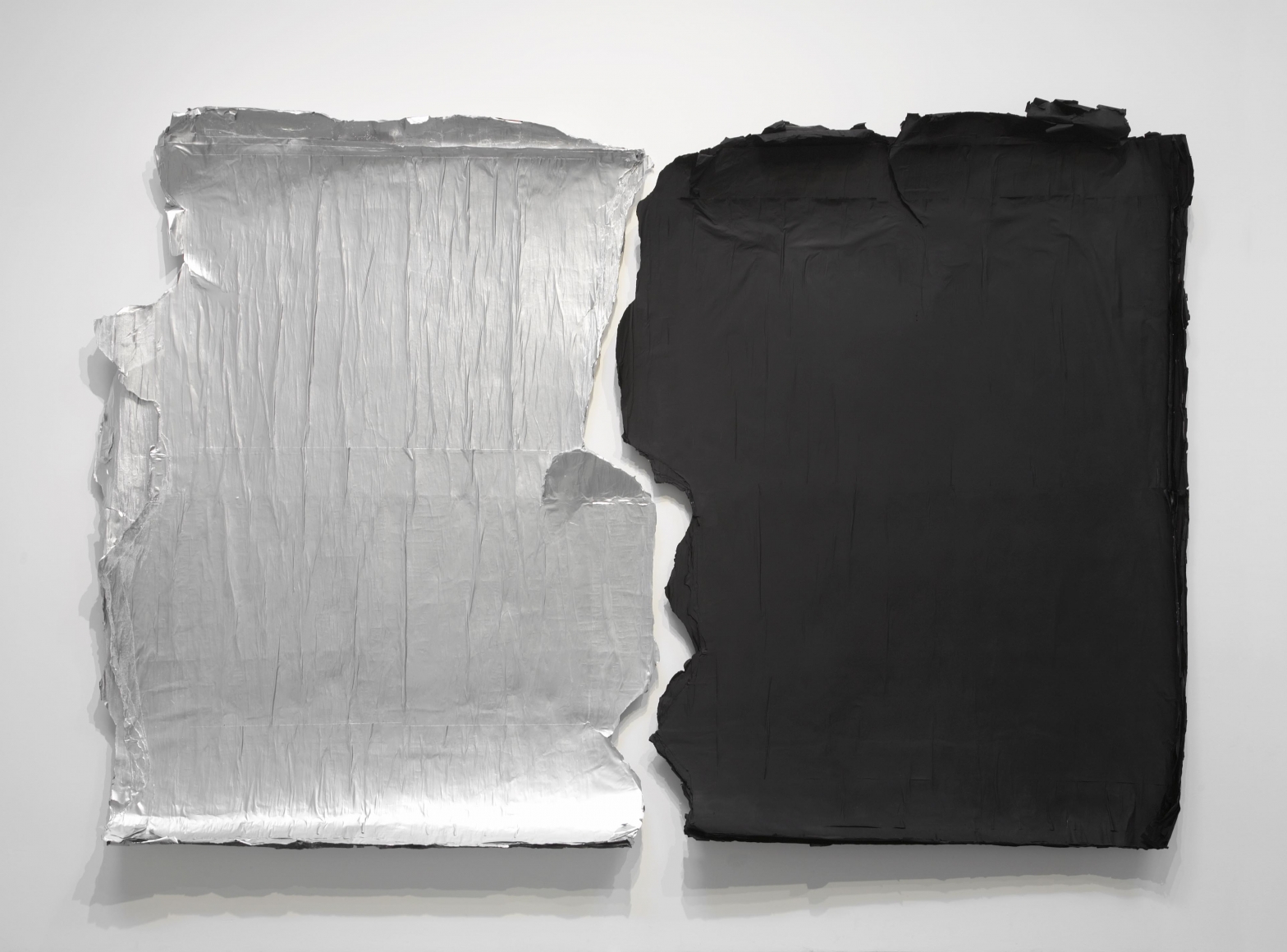 silver and black panels peeling off the wall by jeroen jongeleen