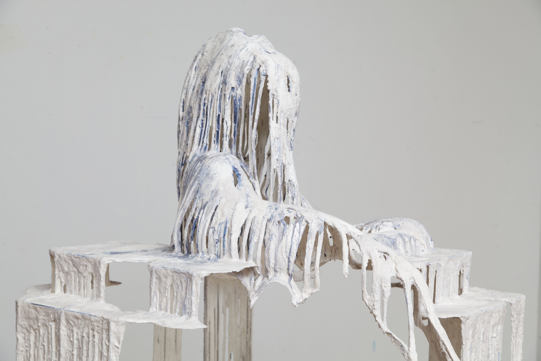 a detail of a white drip sculpture by the artist Diana Al-Hadid available for purchase