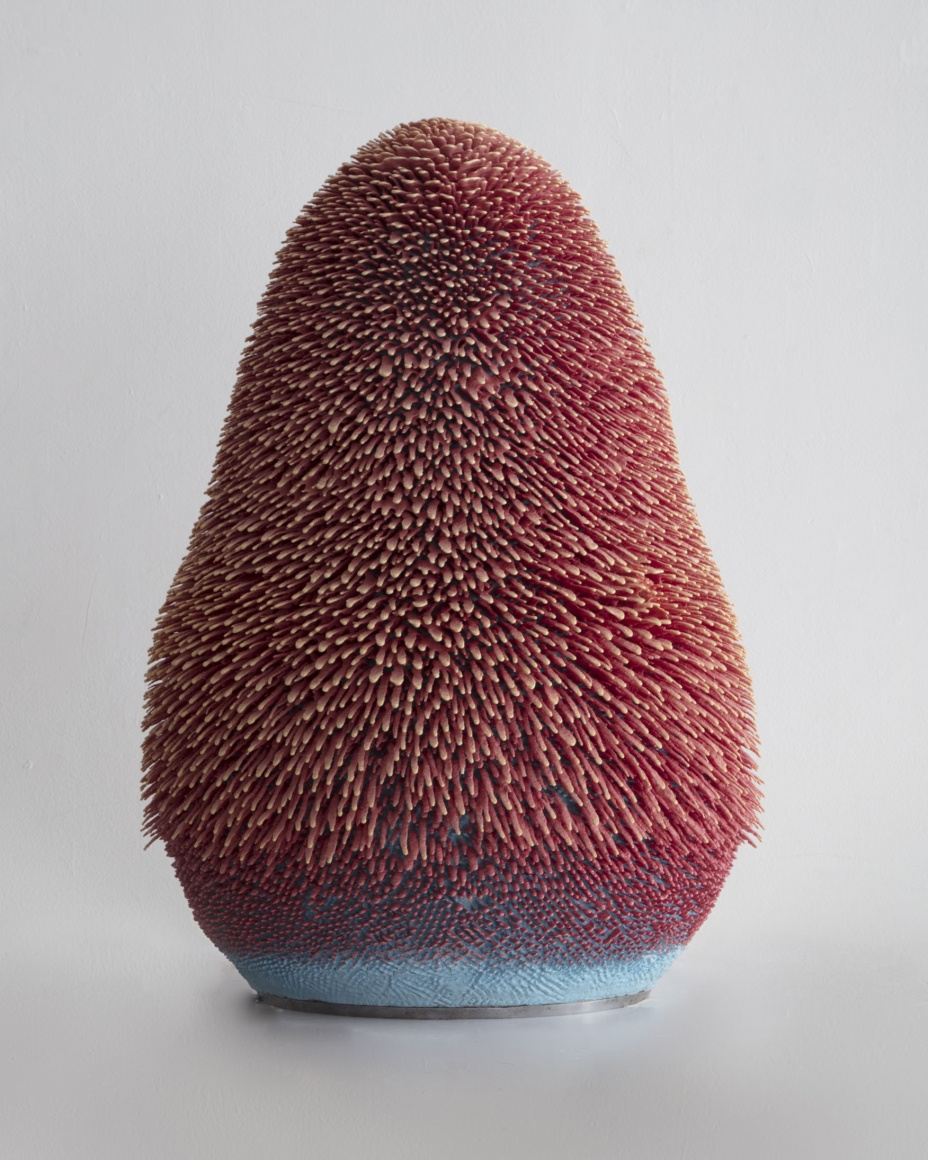 Pink and blue porcelain sculpture with gold accents by the artists the haas brothers