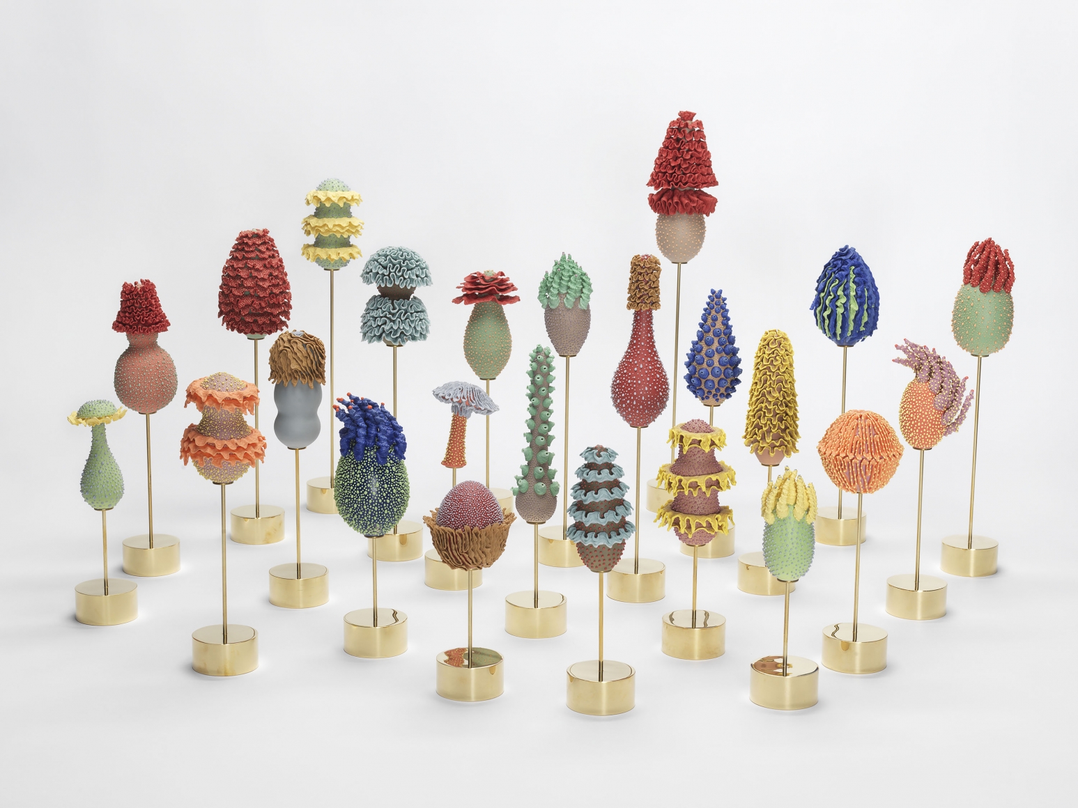 Group of multicolored ceramic egg-shaped sculptures by the artists the haas brothers