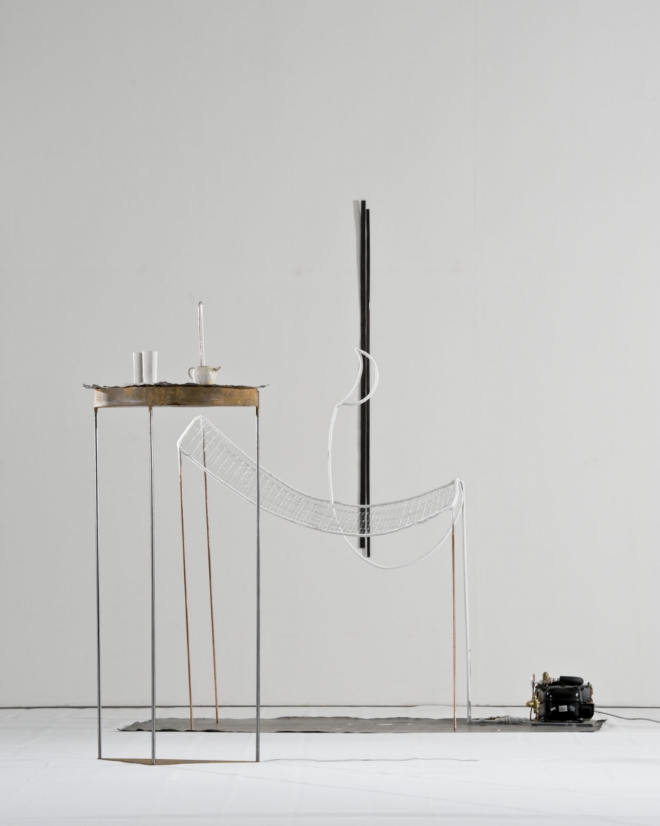Untitled, 2010, Burnt wood,refrigeration unit, refrigerator motor, lead, iron, majolica, copper, closed-loop water pump