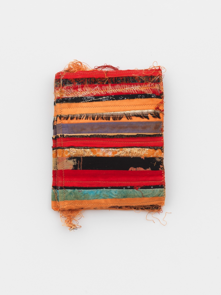 a small fabric book by italian textile artist maria lai