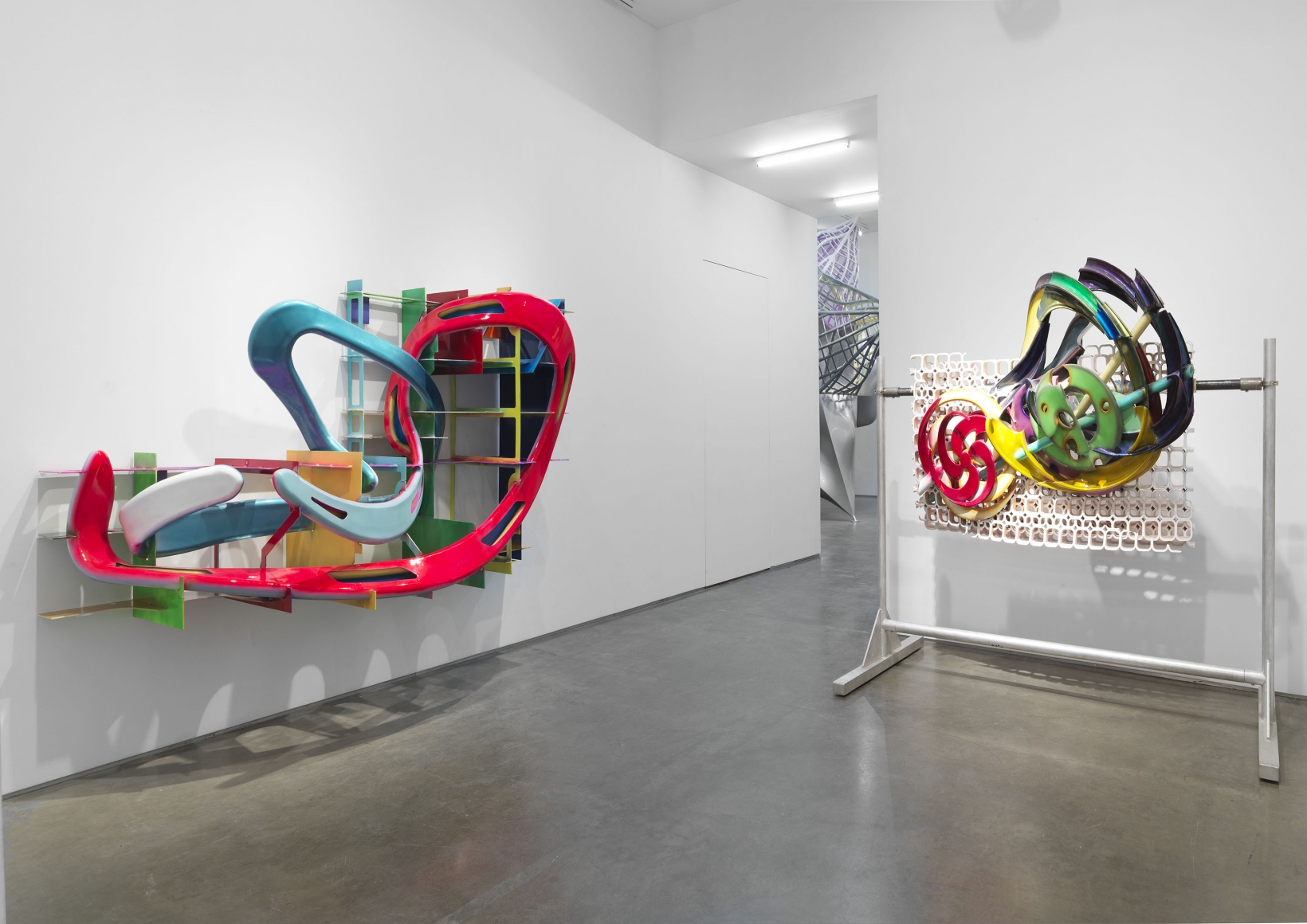A bent steel sculpture and a 3-d printed sculpture by Frank Stella