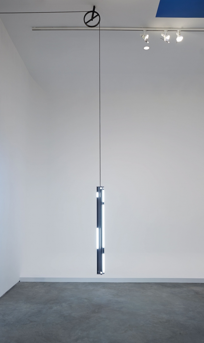 installation by matthias bitzer with fluorescent lights dangling from the ceiling
