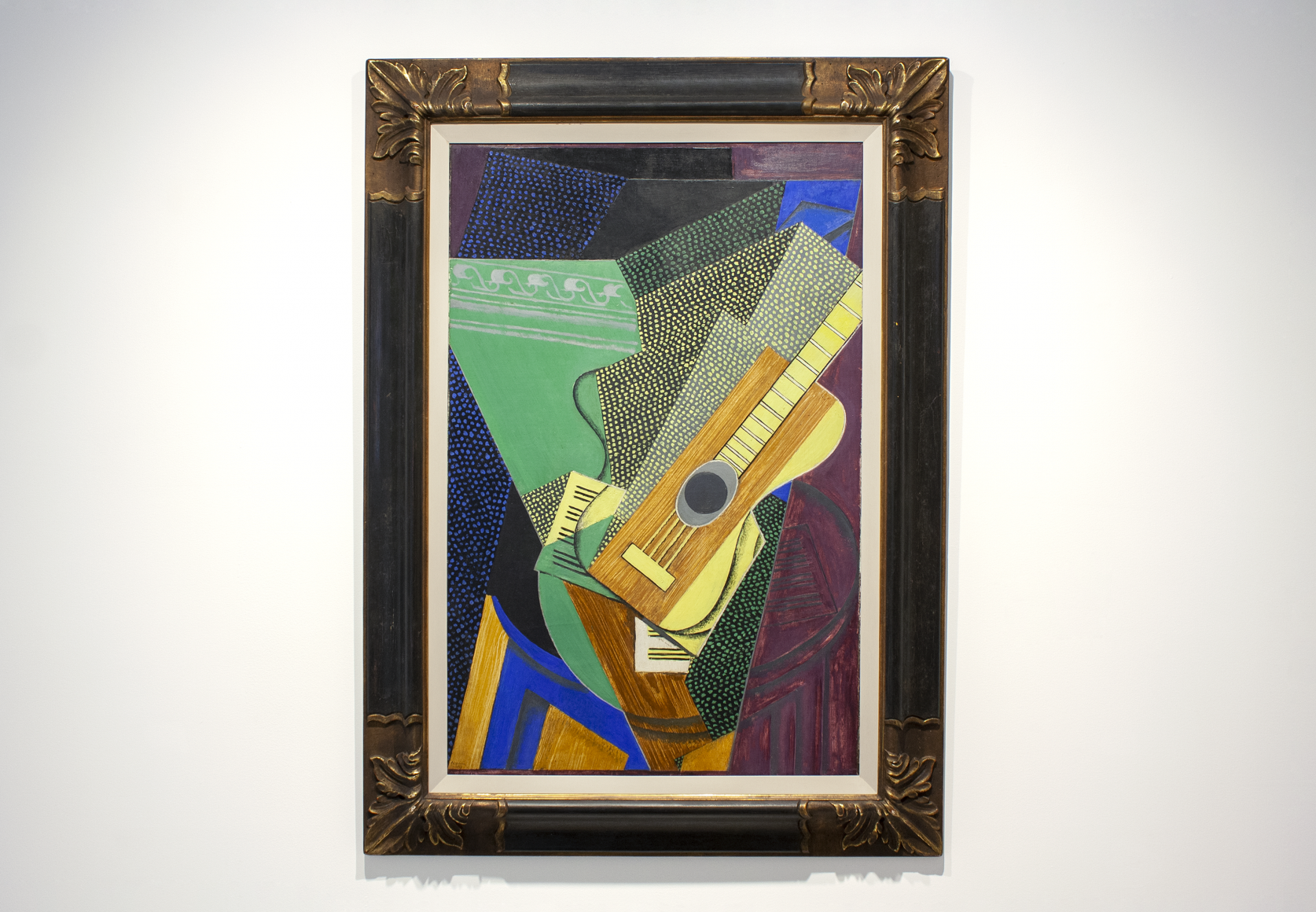 This installation view features a close up of Juan Gris's painting titled, Guitar, and produced in 1916.