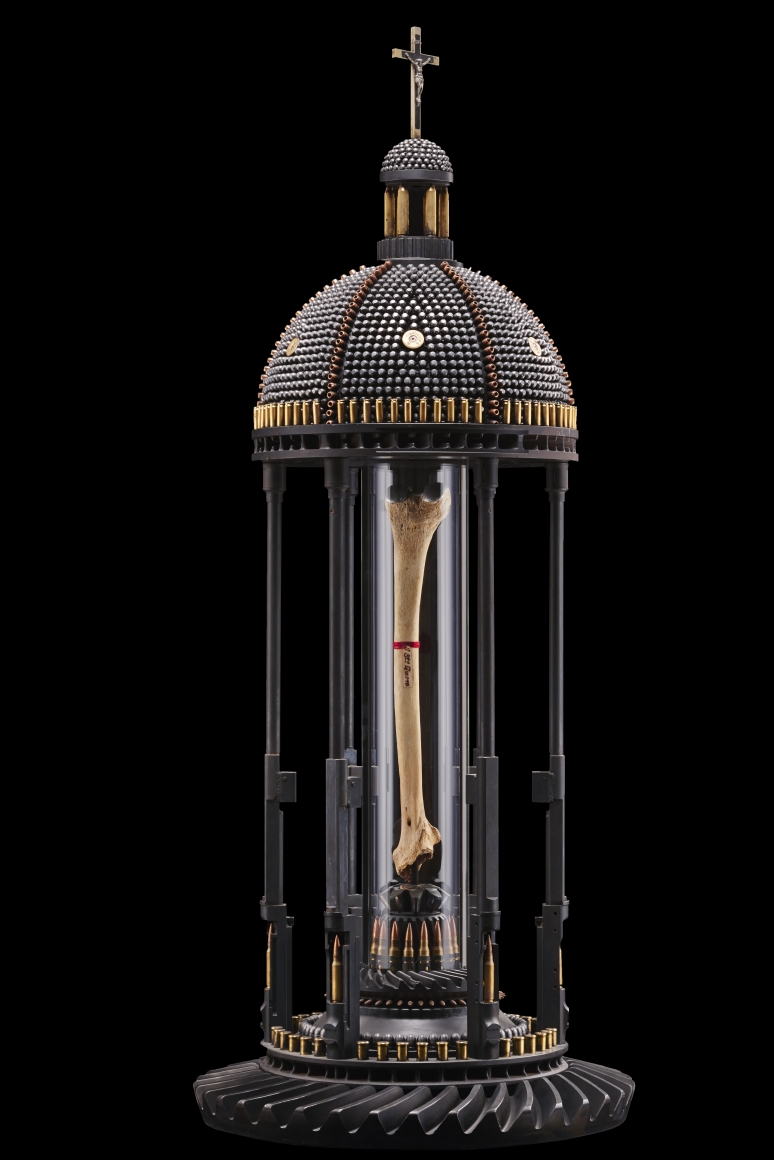 Al Farrow, Femur of Santo Guerro (II), 2011, gun parts, bullets, steel, glass, bone with titanium knee replacement, 48 x 18 x 18 inches