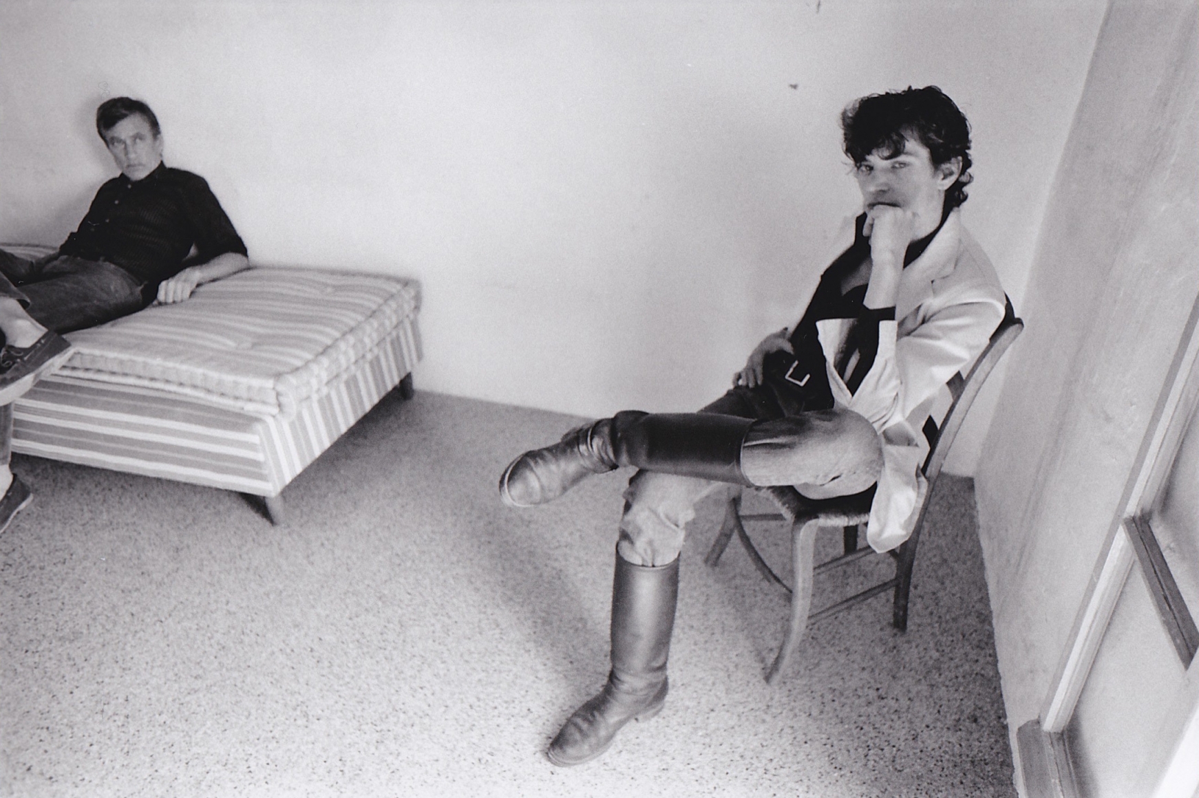 Man on bed and man on chair by Teresa Engle