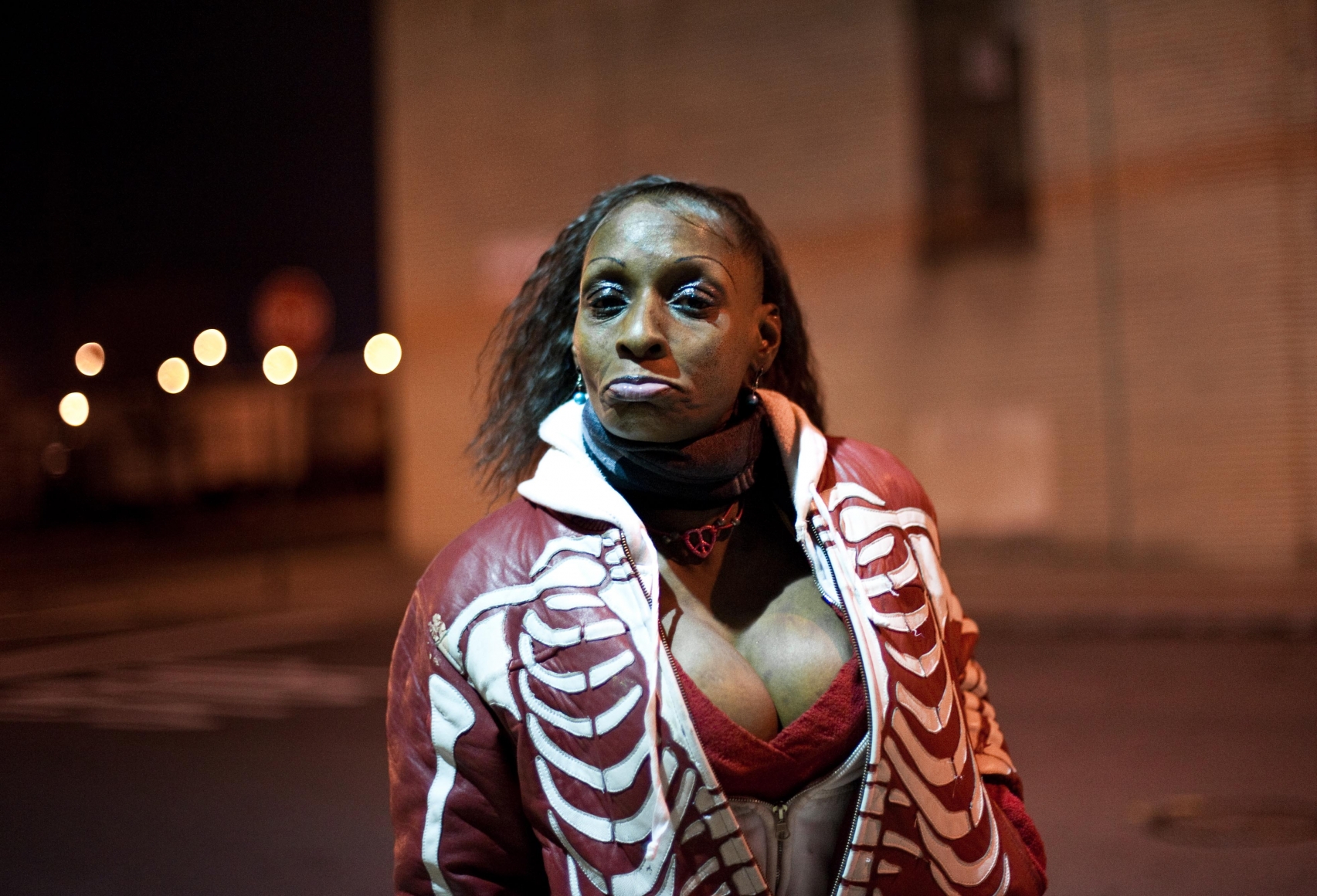 Woman at night by Chris Arnade