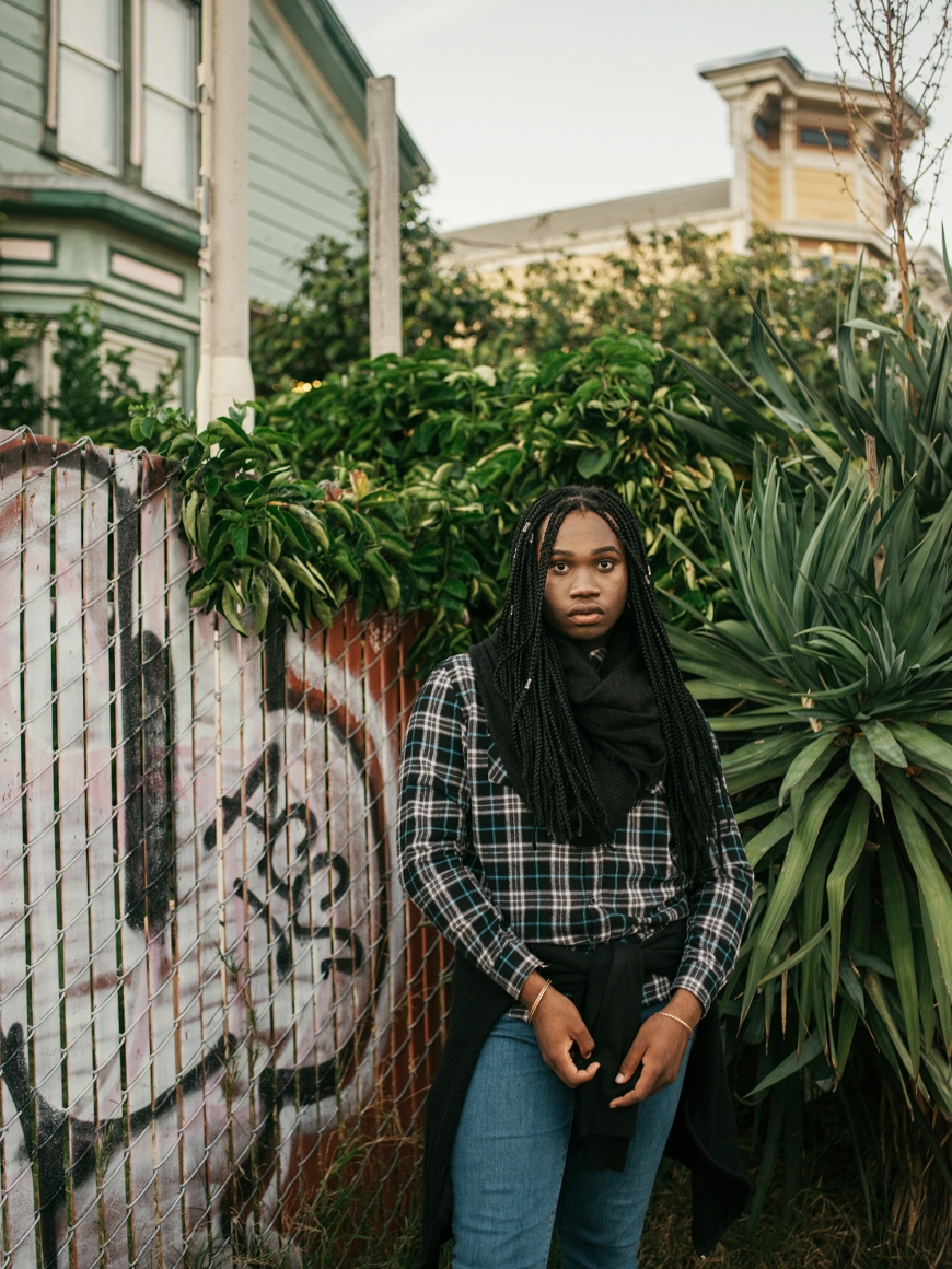 Woman near fence by Annie Tritt