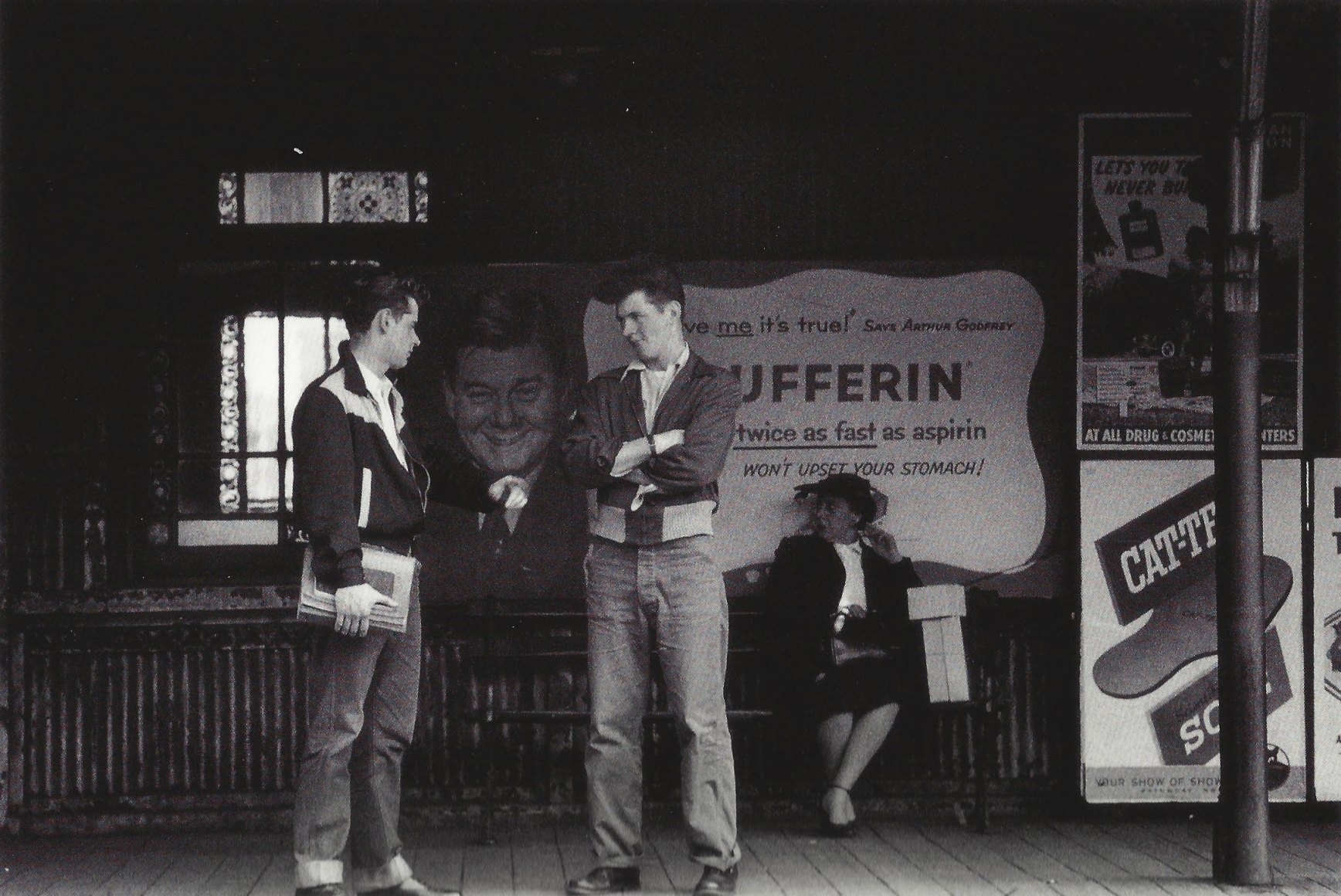 Men waiting for train by Vivian Cherry