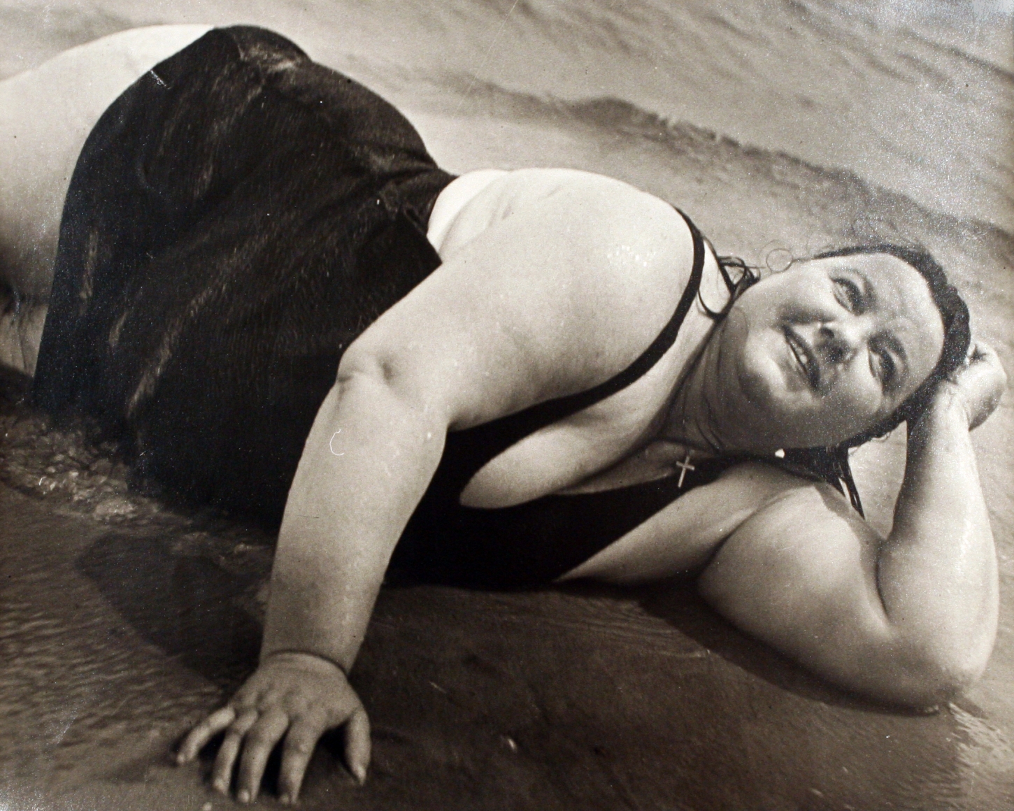 Lisette Model - Coney Island Bather, New York (Reclining), 1939-1940 Gelatin silver print, printed c. 1950 ; Bruce Silverstein Gallery