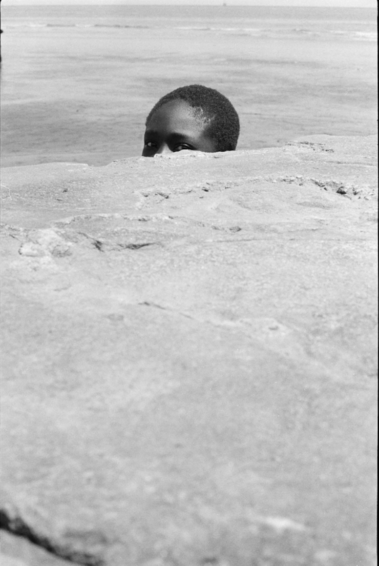 Jimmie Mannas ; Peeping Sea Wall Beach Boy, Sea Wall, Georgetown, Guyana, 1972 ; Bruce Silverstein Gallery